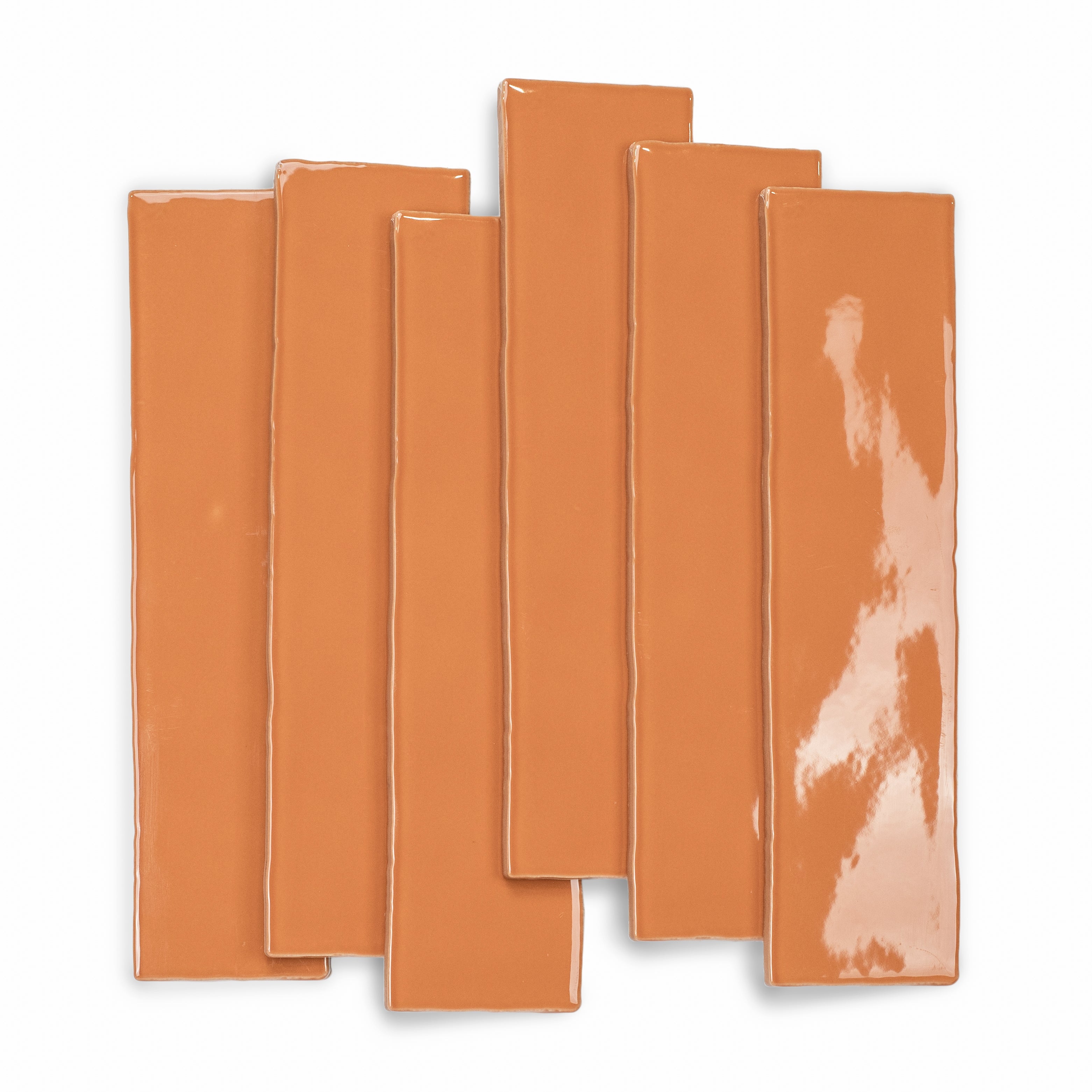 Terracotta 3x12 Glossy Ceramic Tile in warm burnt orange with a vibrant gloss and subtly irregular edges from Seville Glossy Ceramic Tiles