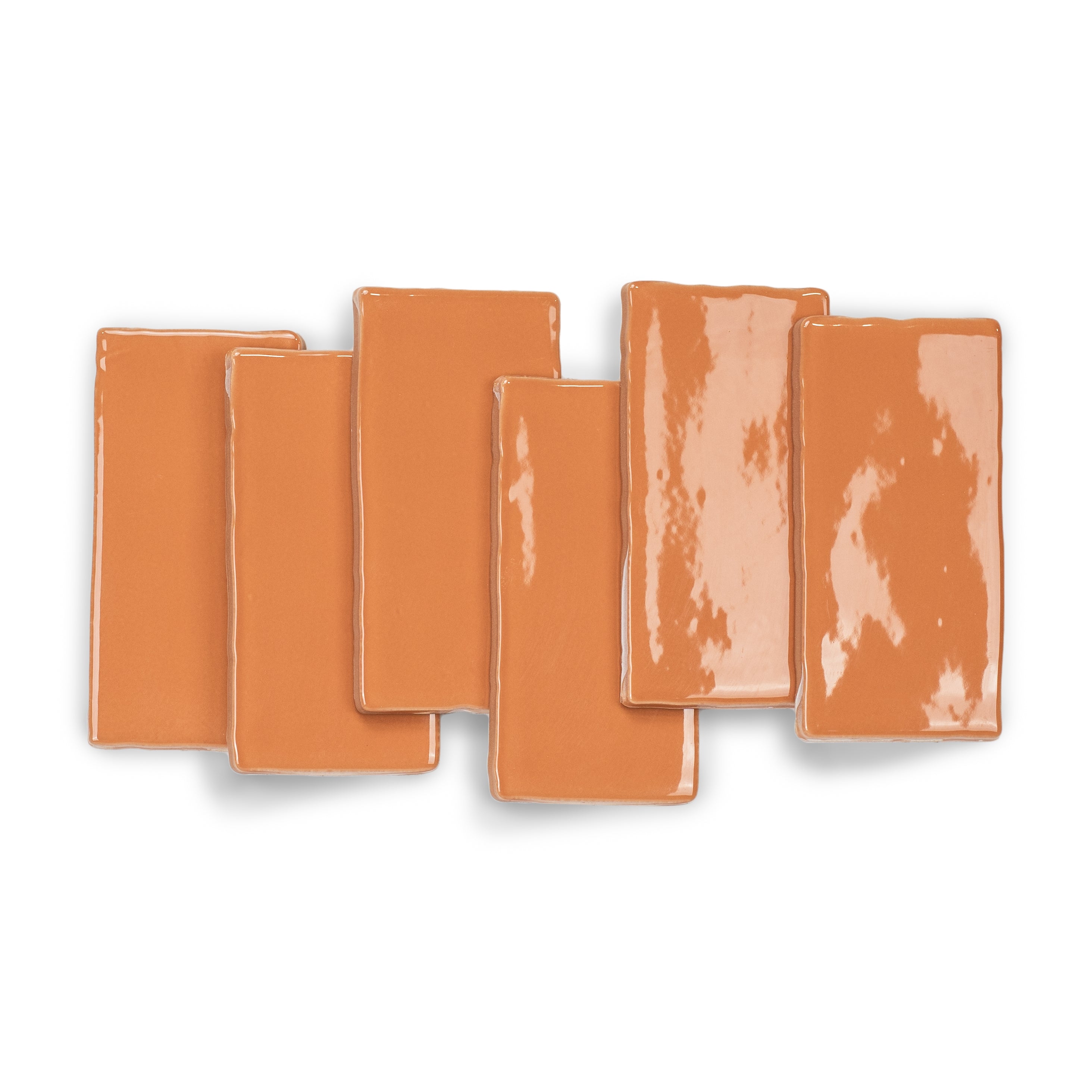 Terracotta 3x6 Glossy Ceramic Tile in warm burnt orange with vibrant gloss and subtly uneven edges from Seville collection