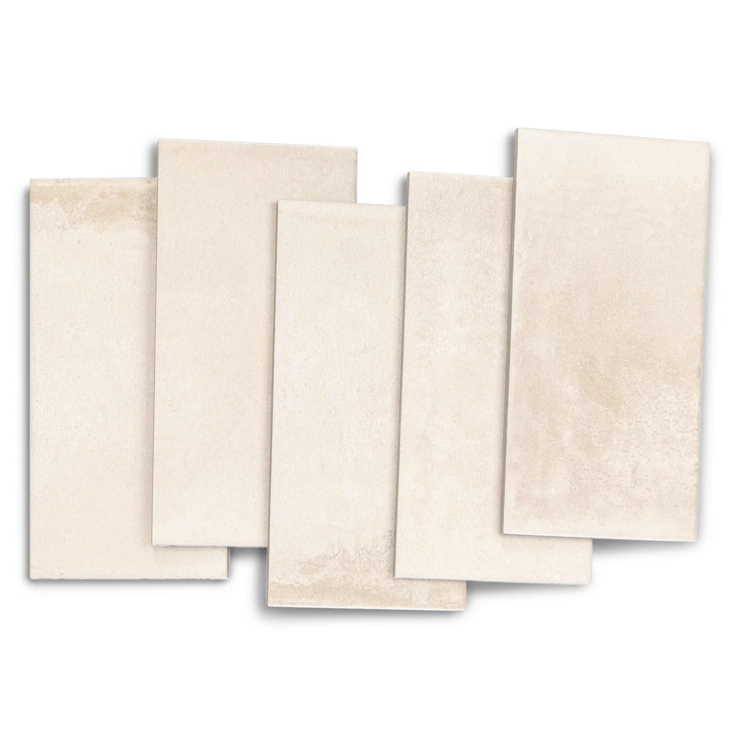 Five light beige ceramic tiles arranged overlapping on a white background