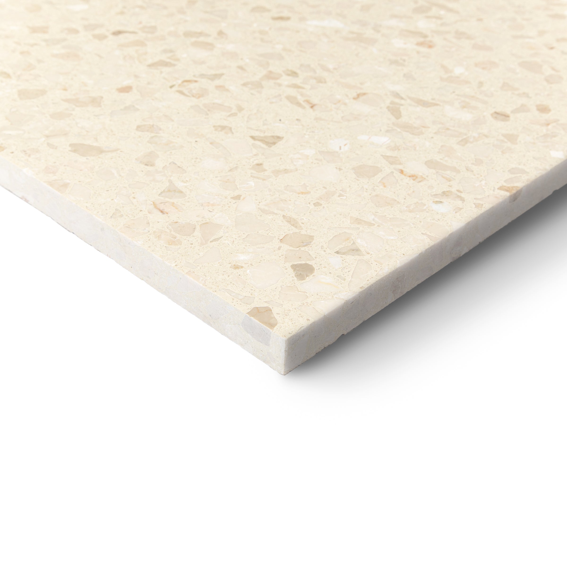 Cream terrazzo-style tile with a speckled surface and visible edge