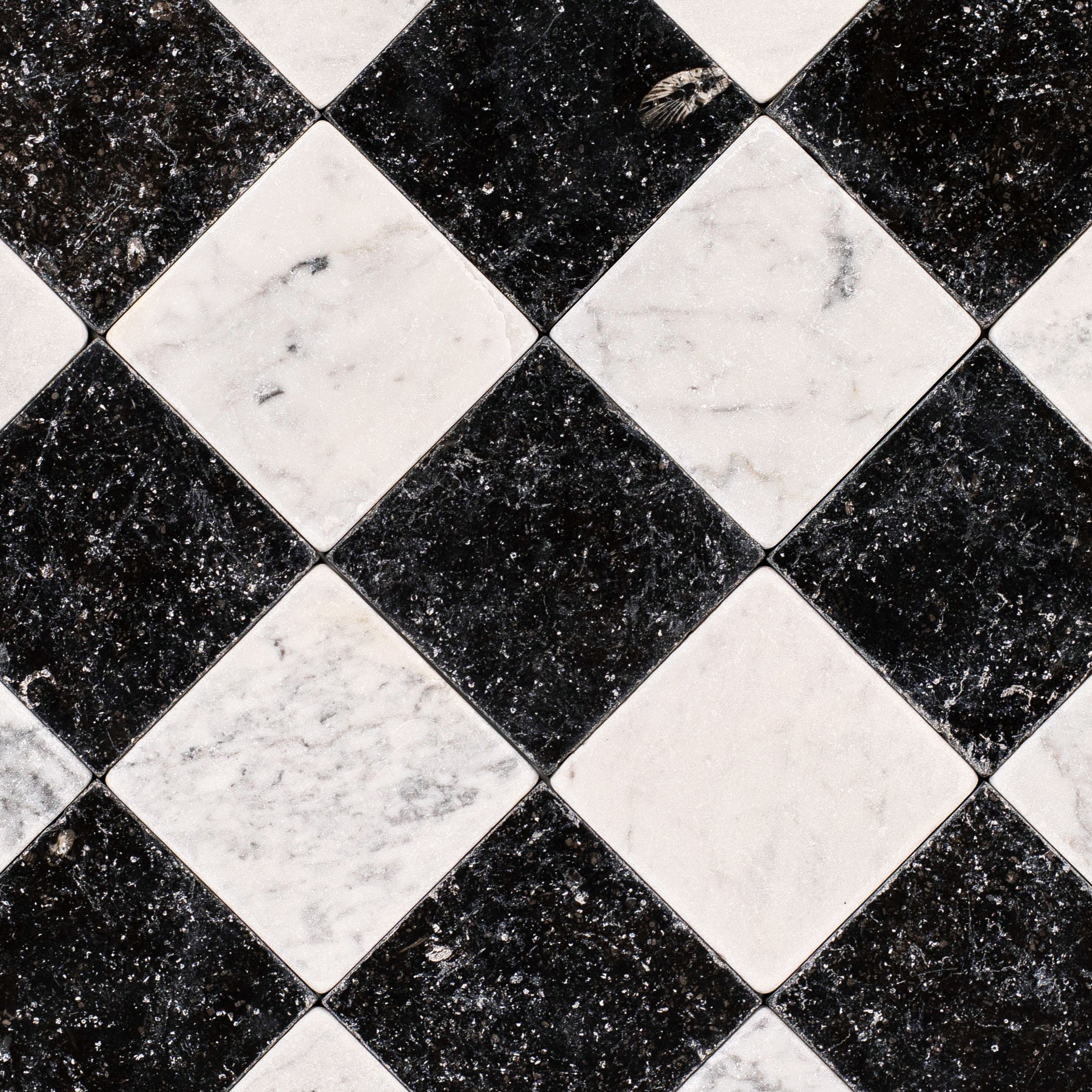 Carrara Belgian Blue Tumbled Stone Checkerboard in gray, black, and white marble from Tumbled Natural Stone Tiles at Reno Source