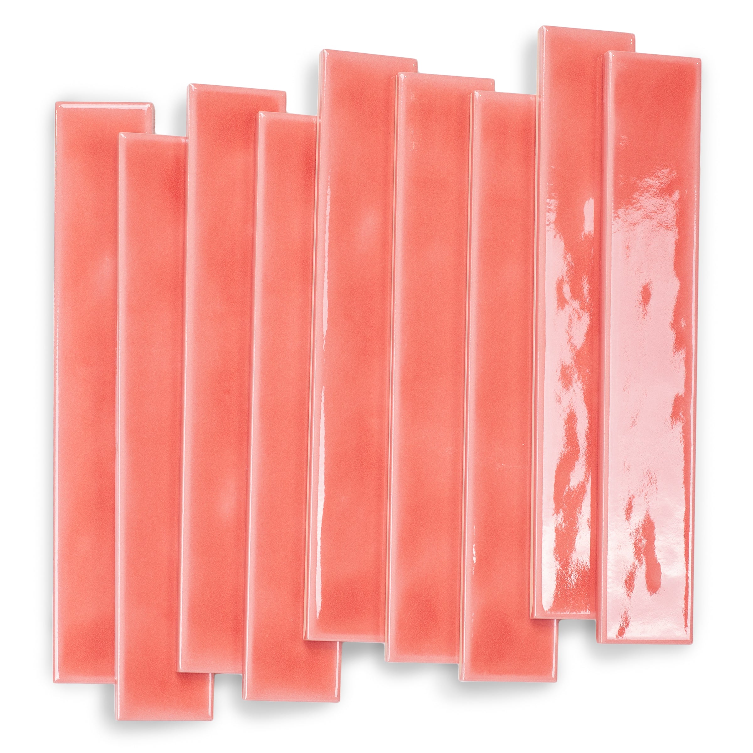 Glossy coral ceramic tiles in slender rectangular shapes with a smooth reflective surface arranged loosely on white background