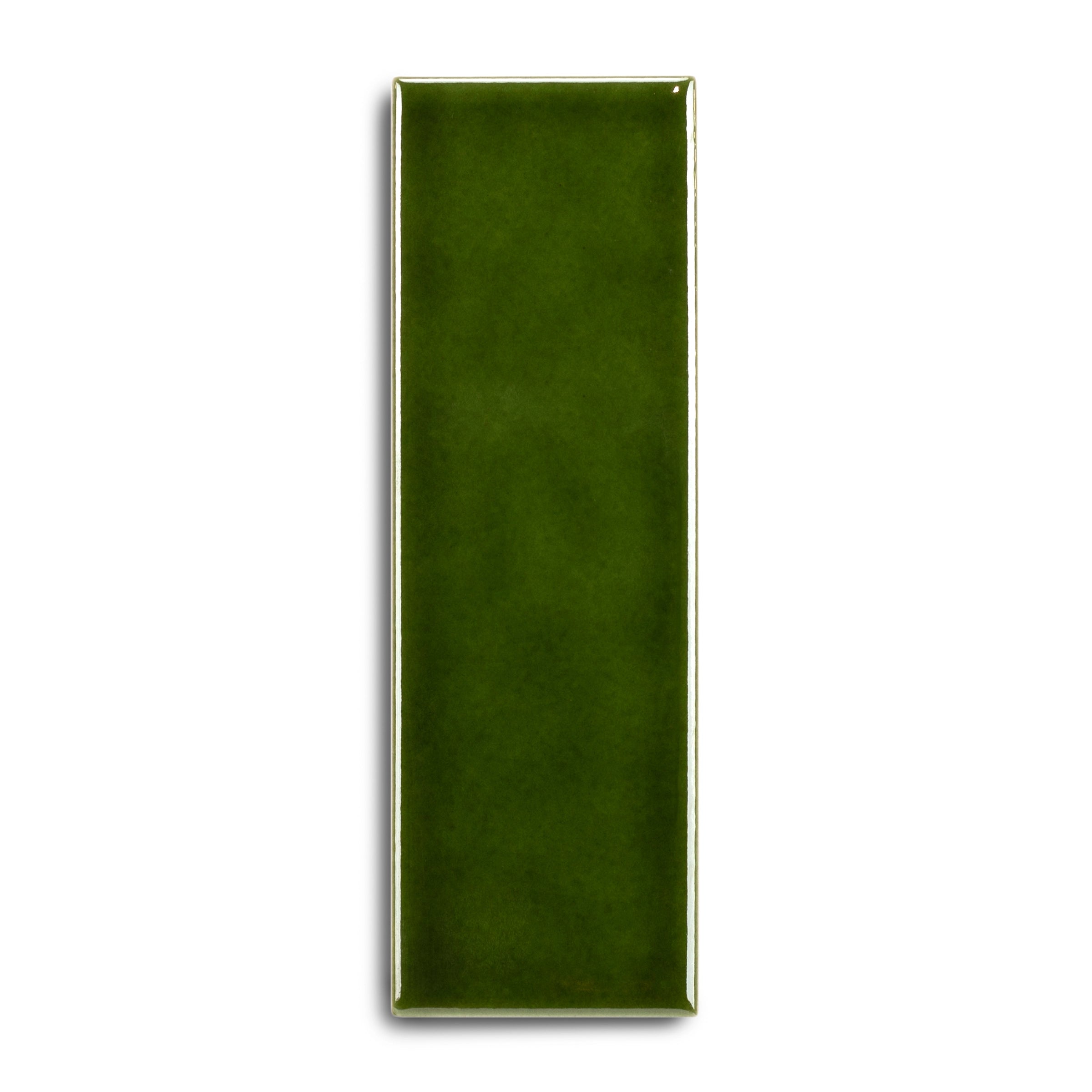 Glossy narrow ceramic tile in deep olive green with smooth edges and a subtle reflective glaze on white background