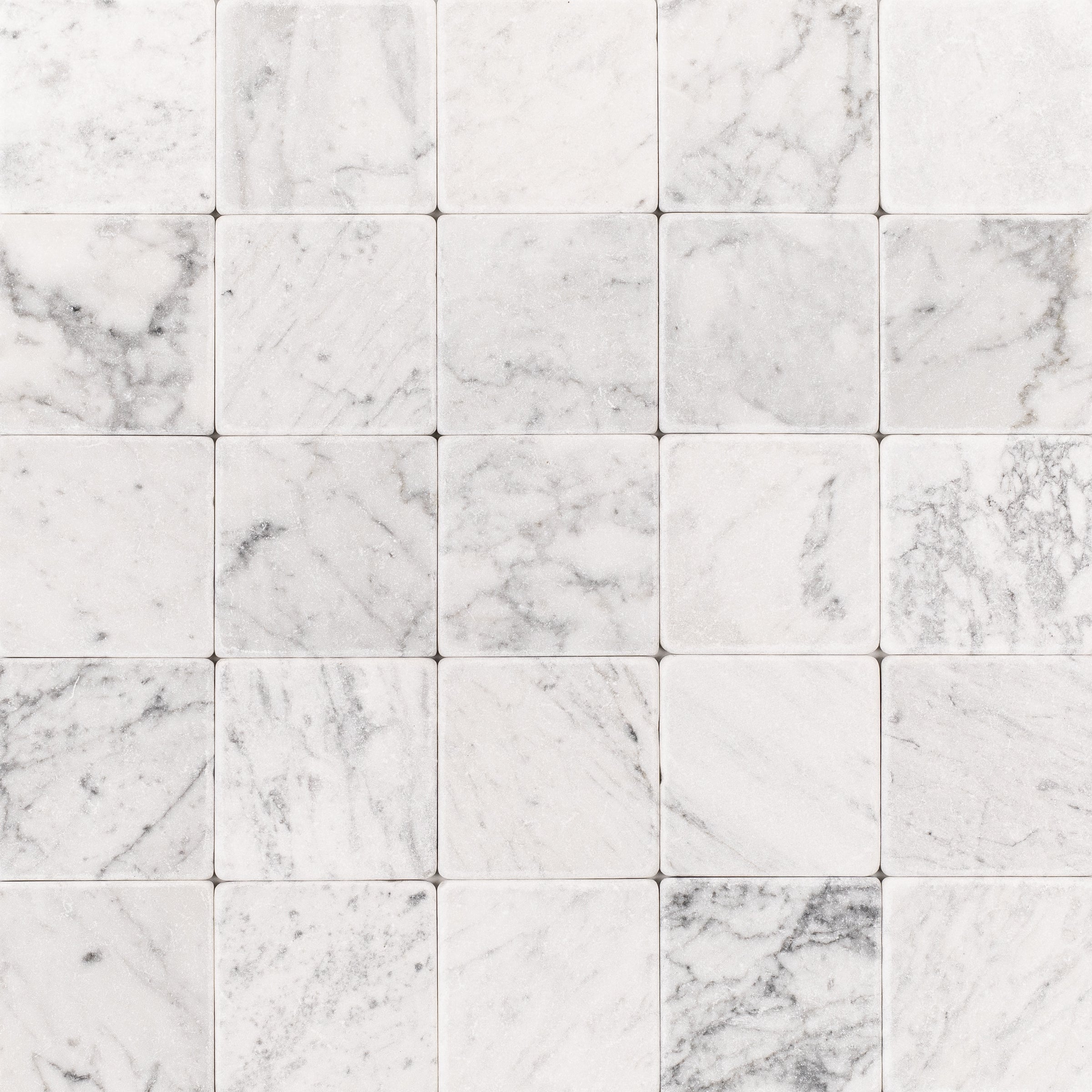 Carrara 4x4 Tumbled Marble Tile in white and gray marble from Tumbled Natural Stone Tiles, Stone, New Arrivals collections