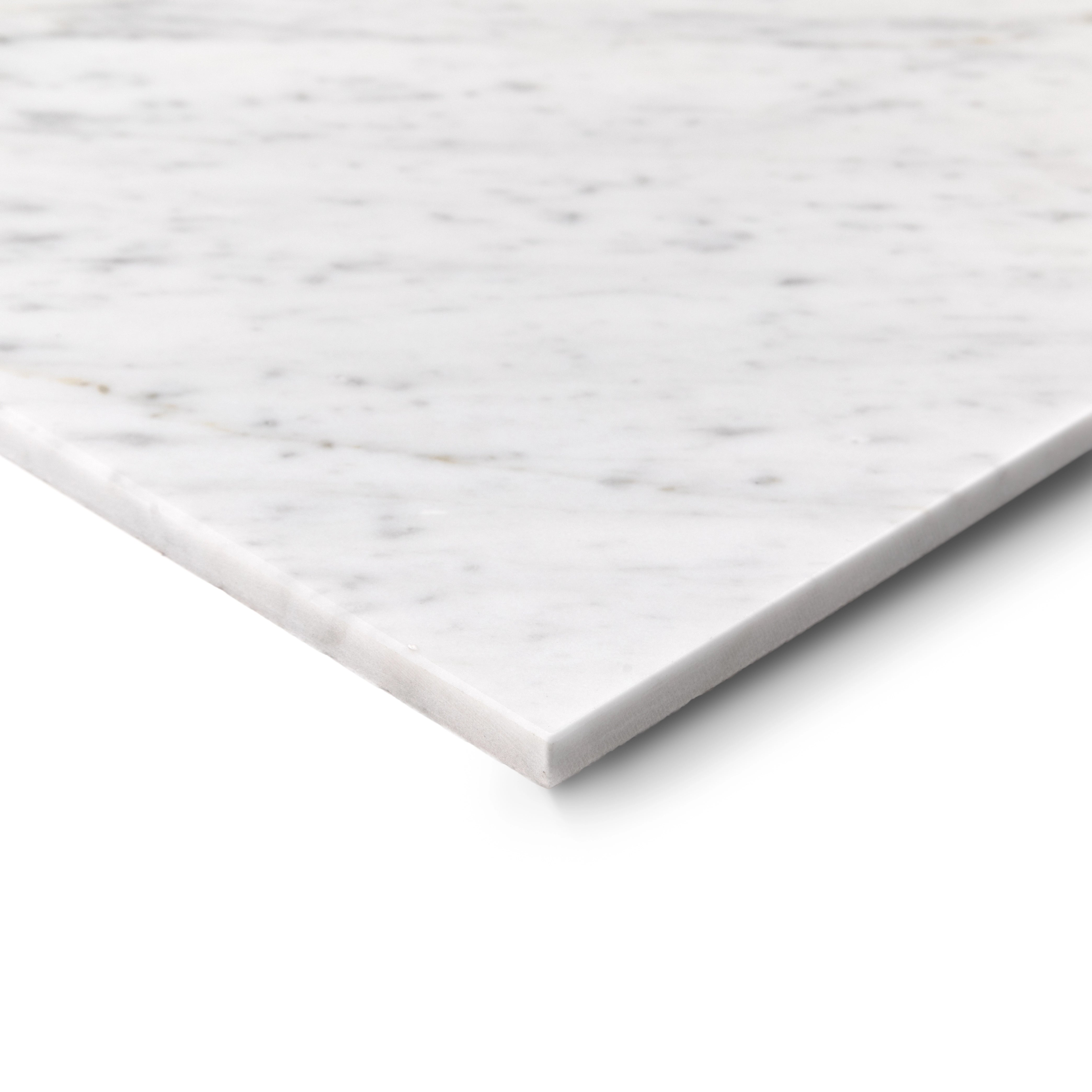 Close-up of a sleek white marble tile with delicate gray veining on a bright white background