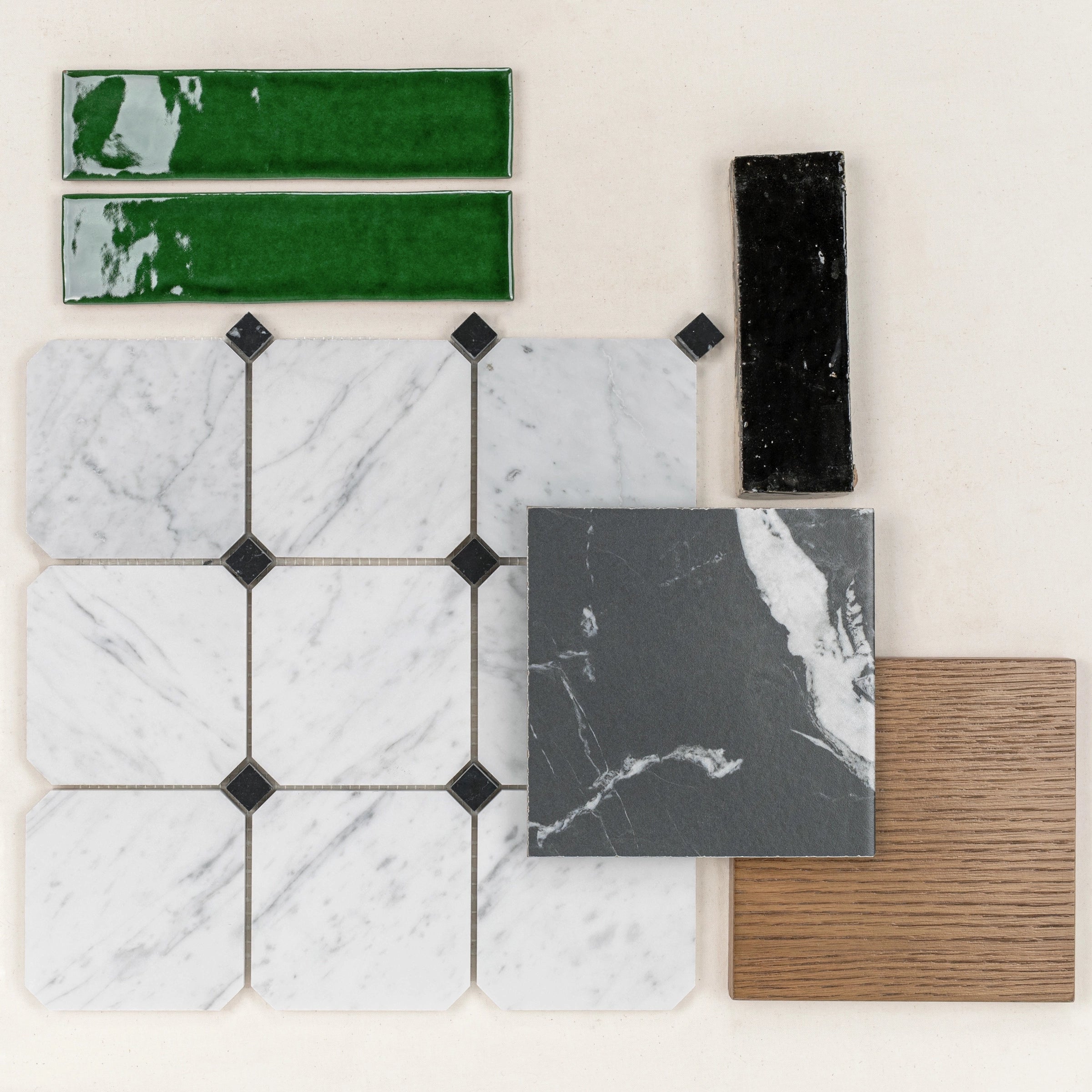 Arrangement of white and black marble tiles with green and black glossy rectangular tiles and a wood-textured square tile
