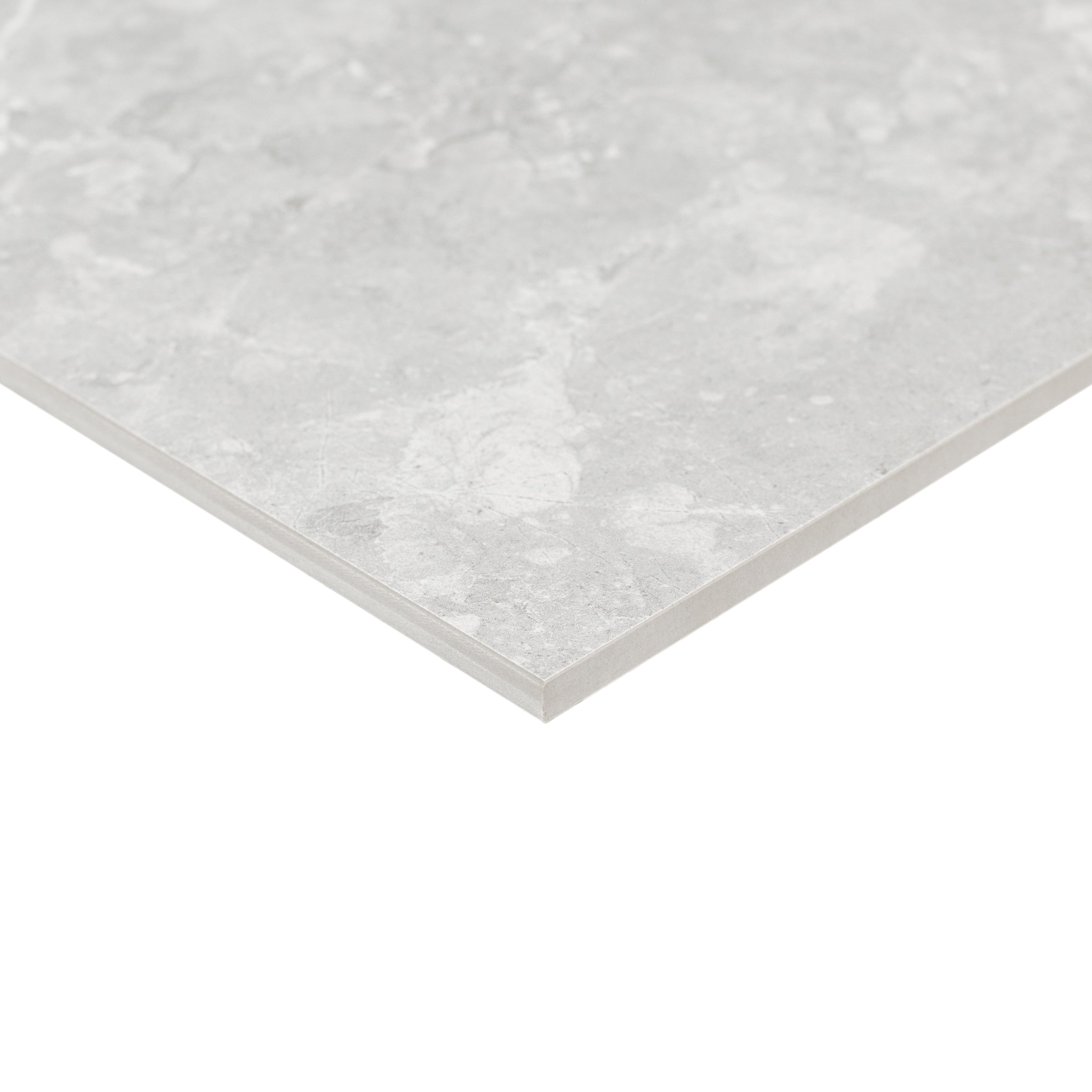 Close-up of a single light gray porcelain tile with subtle natural stone texture and fine color variation