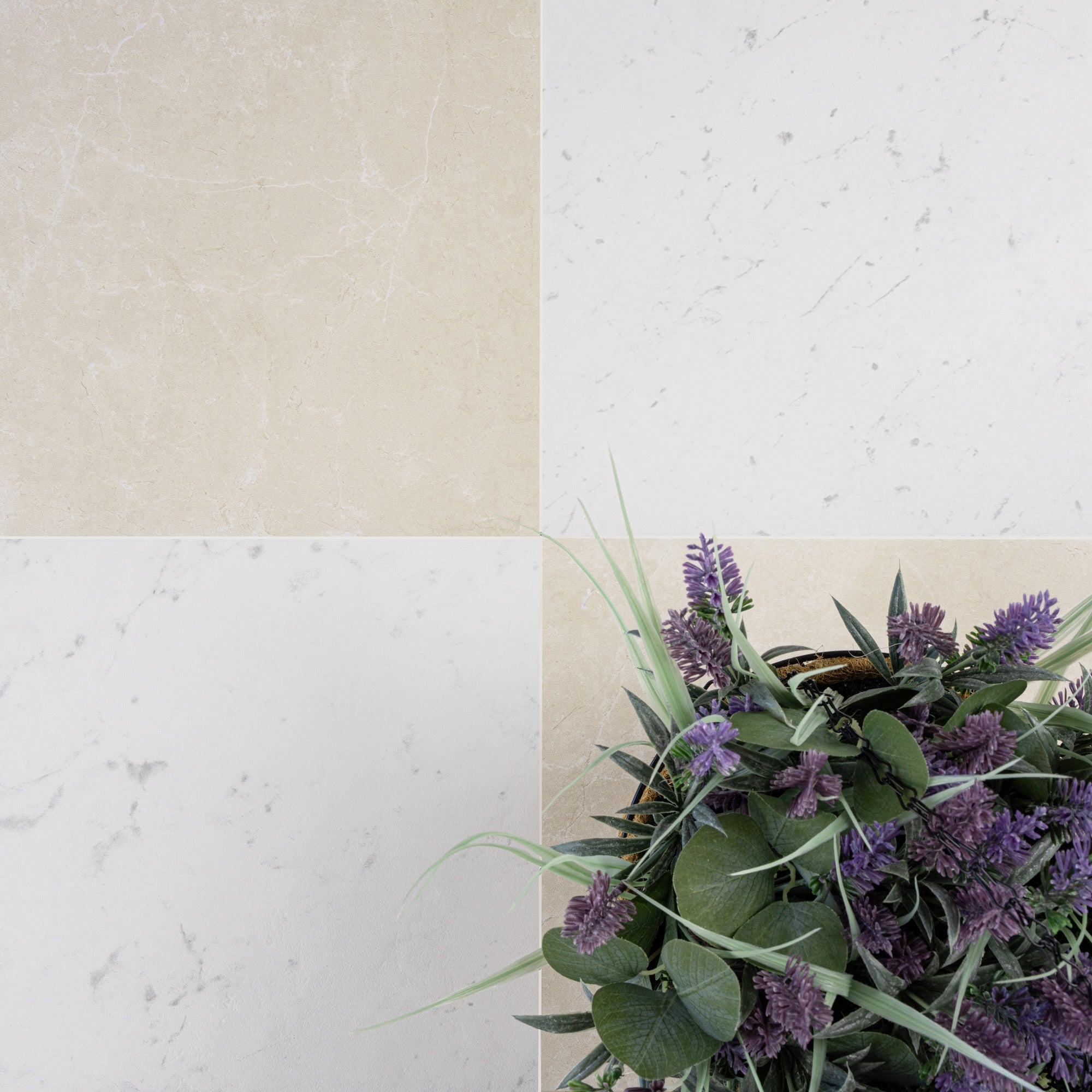 Four large square tiles in soft beige and off-white tones with subtle marble veining and purple flowers in corner