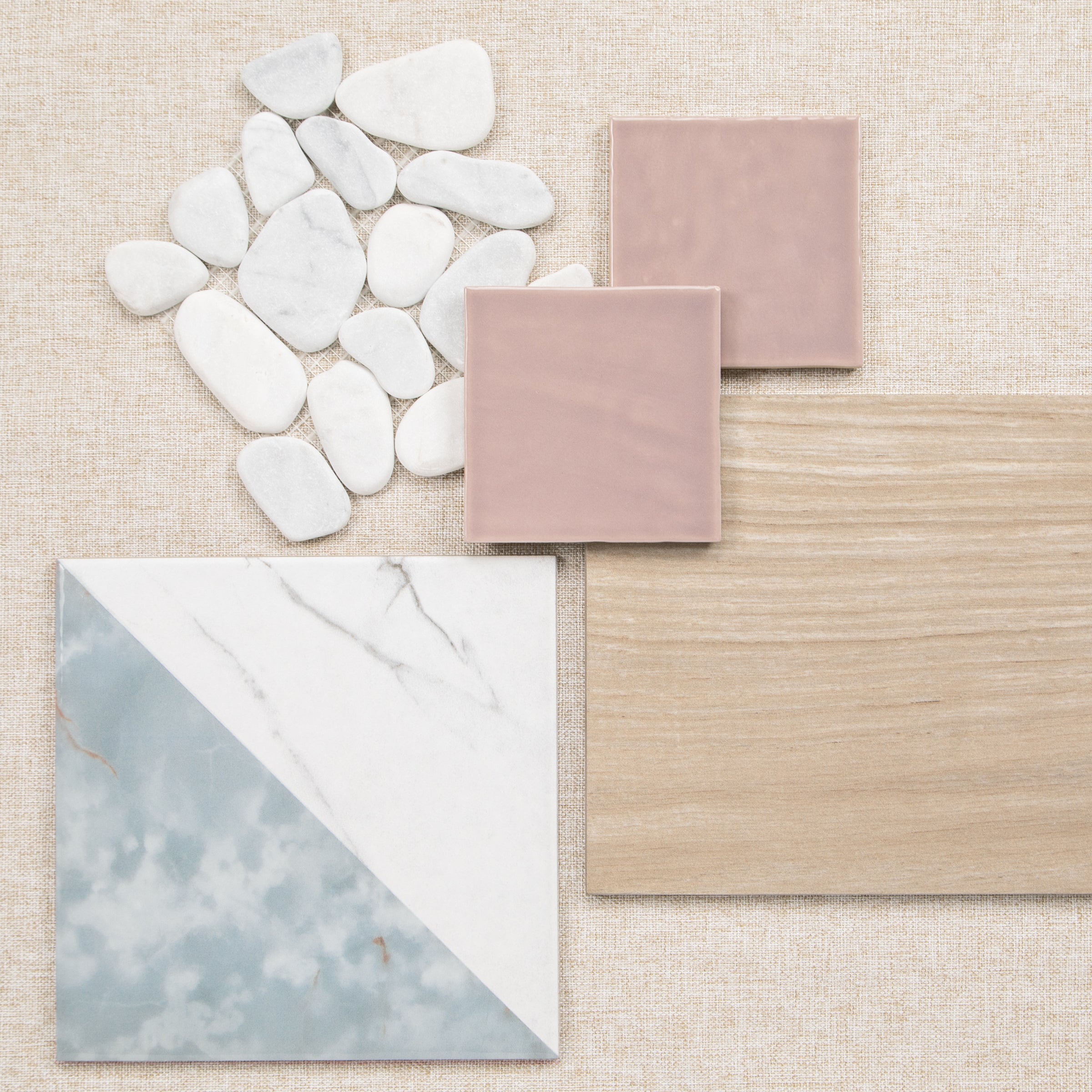 Interior material samples with pink tiles, wood flooring, marble effect tile, and white decorative stones