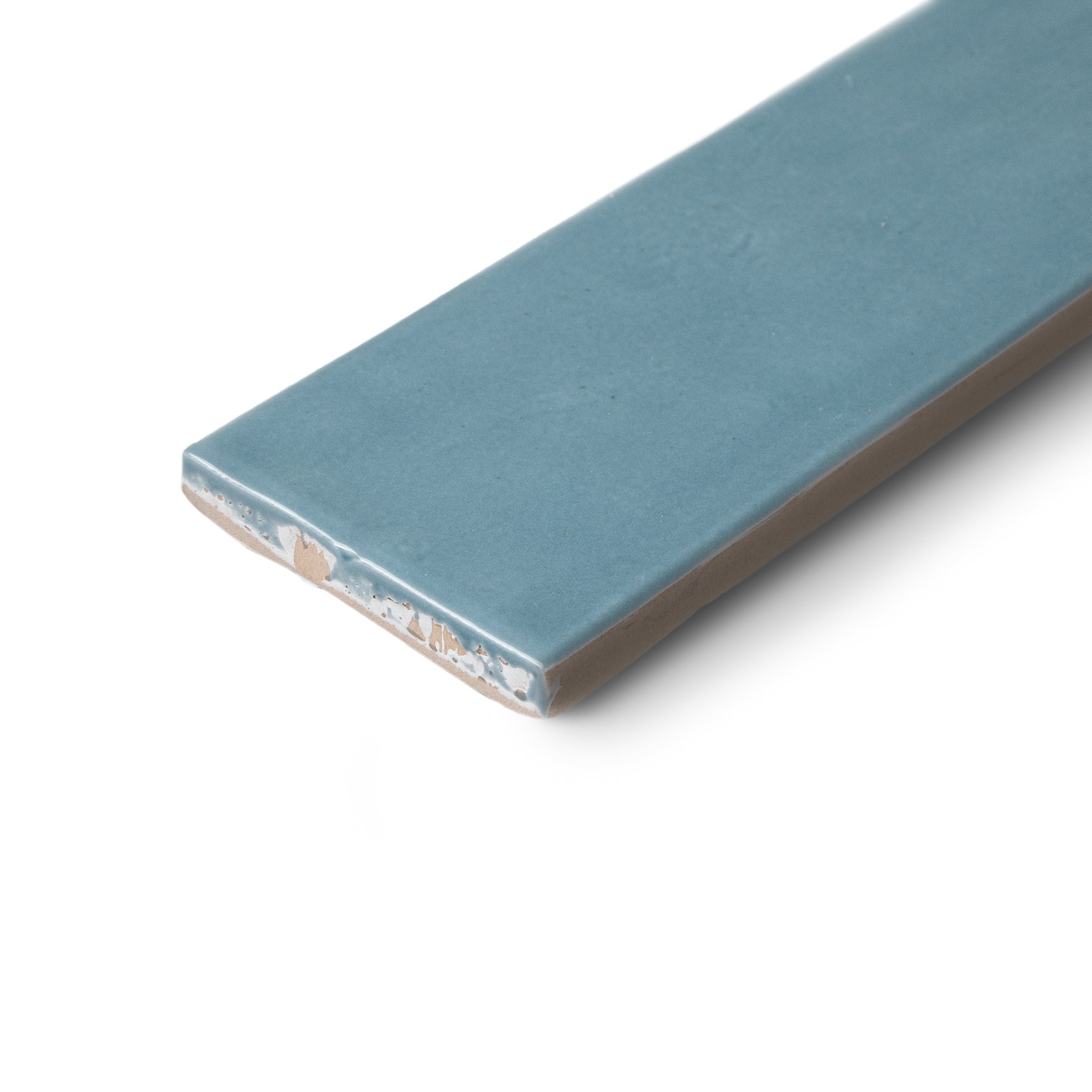 Blue rectangular ceramic tile with a textured surface and visible exposed edge