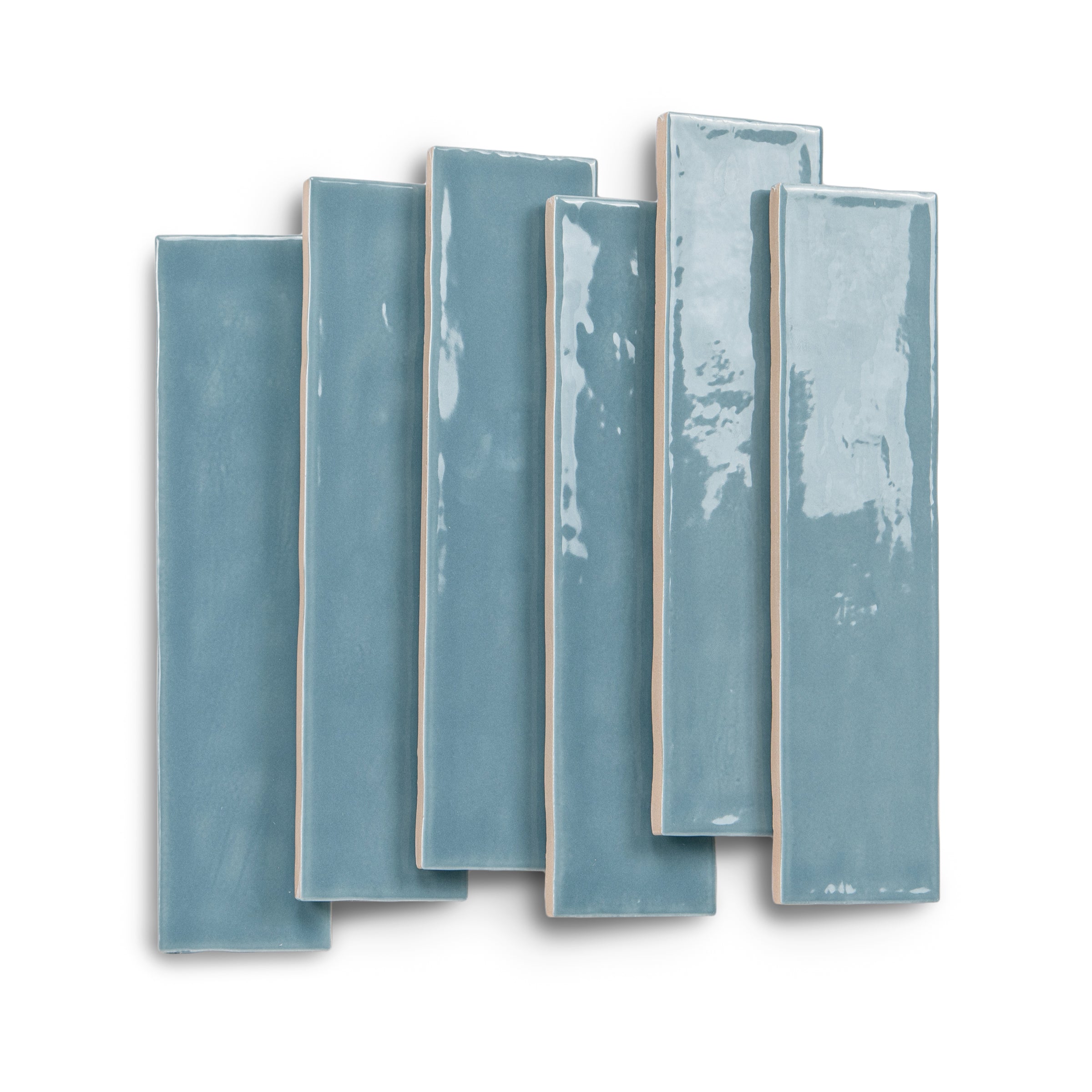 Blue rectangular ceramic tiles with glossy varied surfaces arranged in an overlapping display