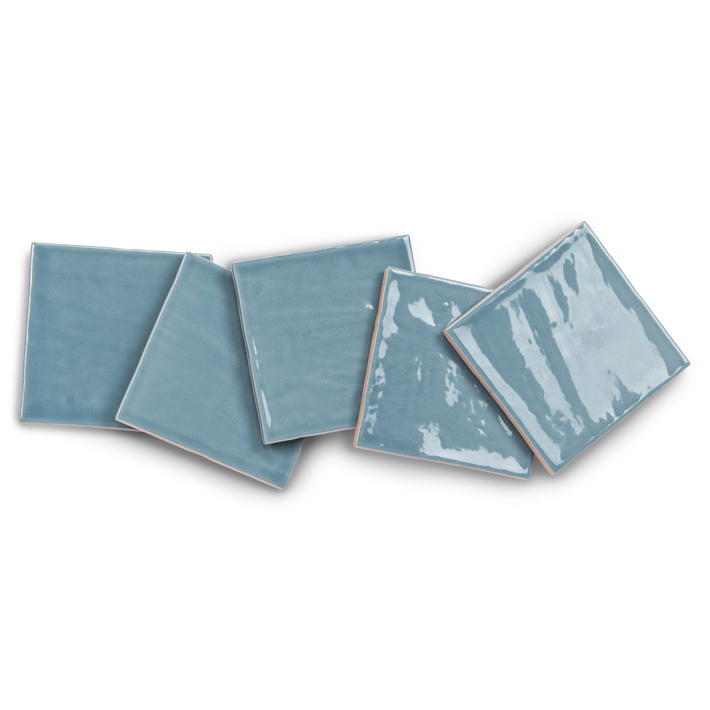 Blue ceramic tiles with varied shapes and glossy finishes