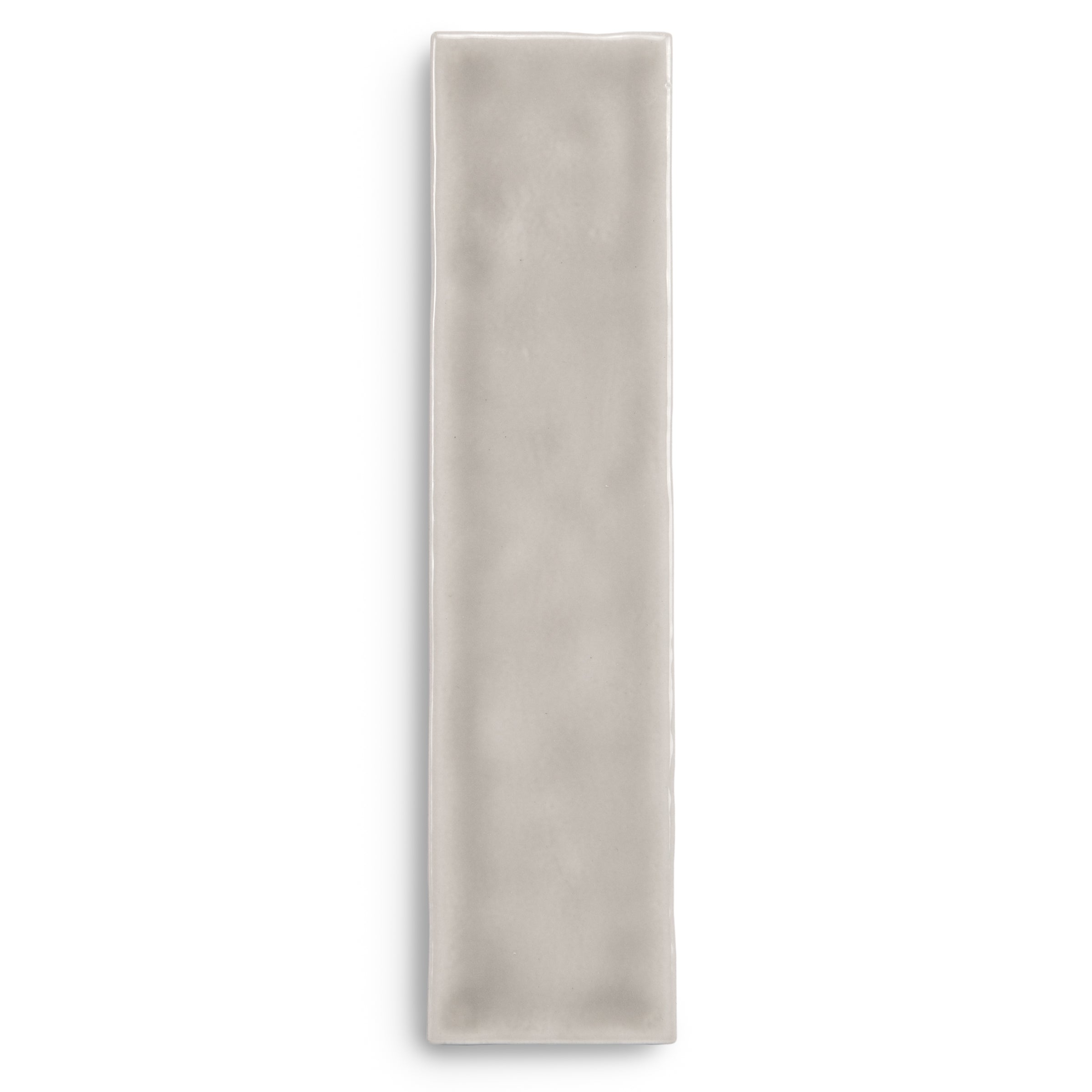 Narrow light gray rectangular tile on a white background