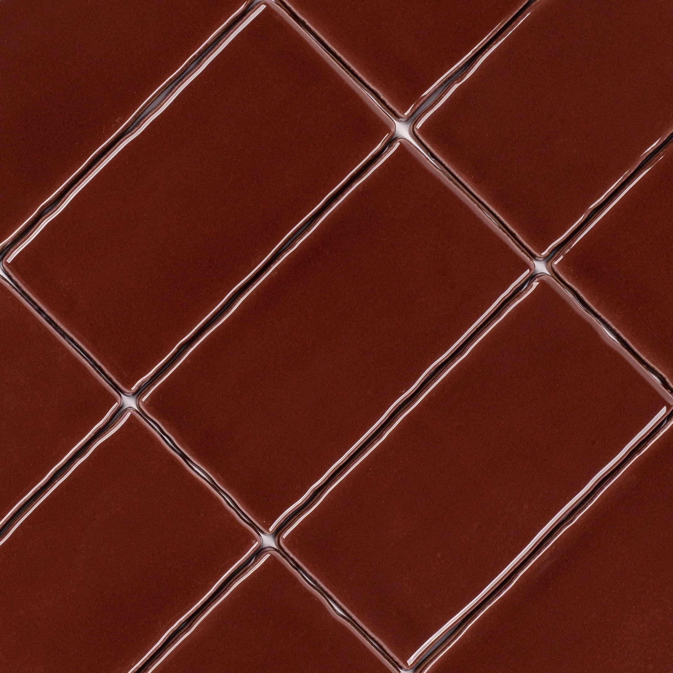 Crimson 3x6 Glossy Ceramic Tile in deep red with rich gloss and a subtly undulating surface from Seville Small Format Tiles collection