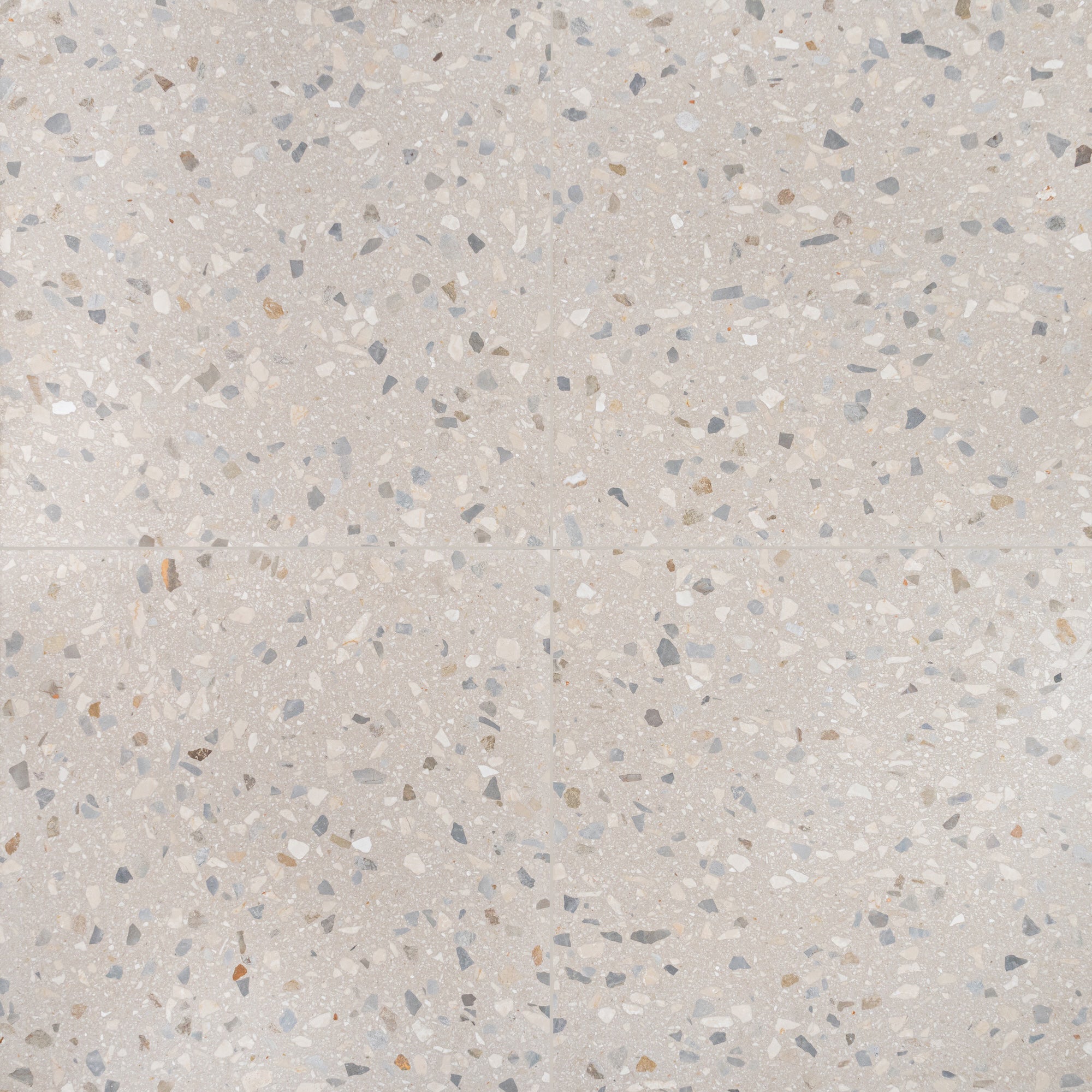 Light terrazzo tile surface with scattered gray, beige, and tan stone chips