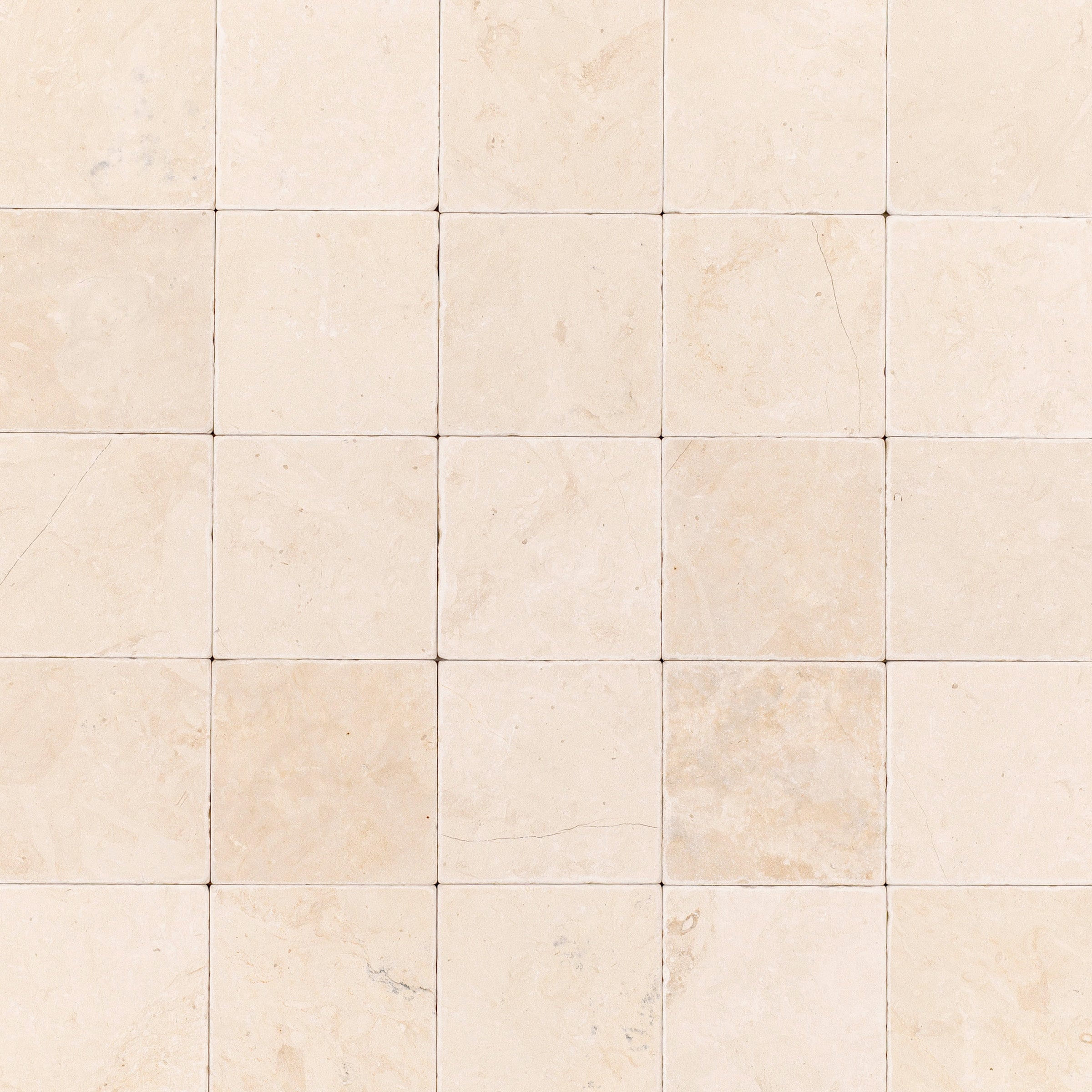 Desert Tea 4x4 Tumbled Marble Tile in beige stone with sand and cream tones from Tumbled Natural Stone Tiles collection