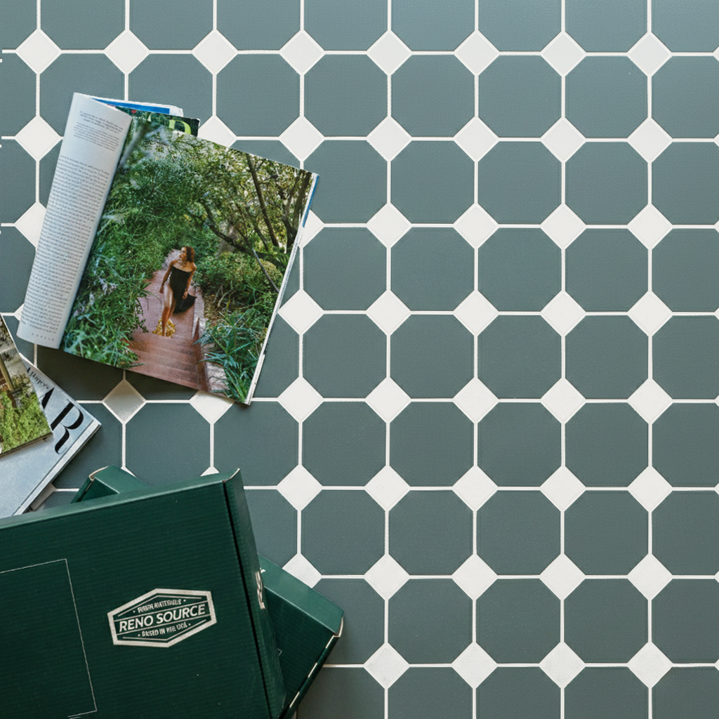 Green octagonal ceramic tiles with white diamond accents and open magazines with Reno Source folder nearby