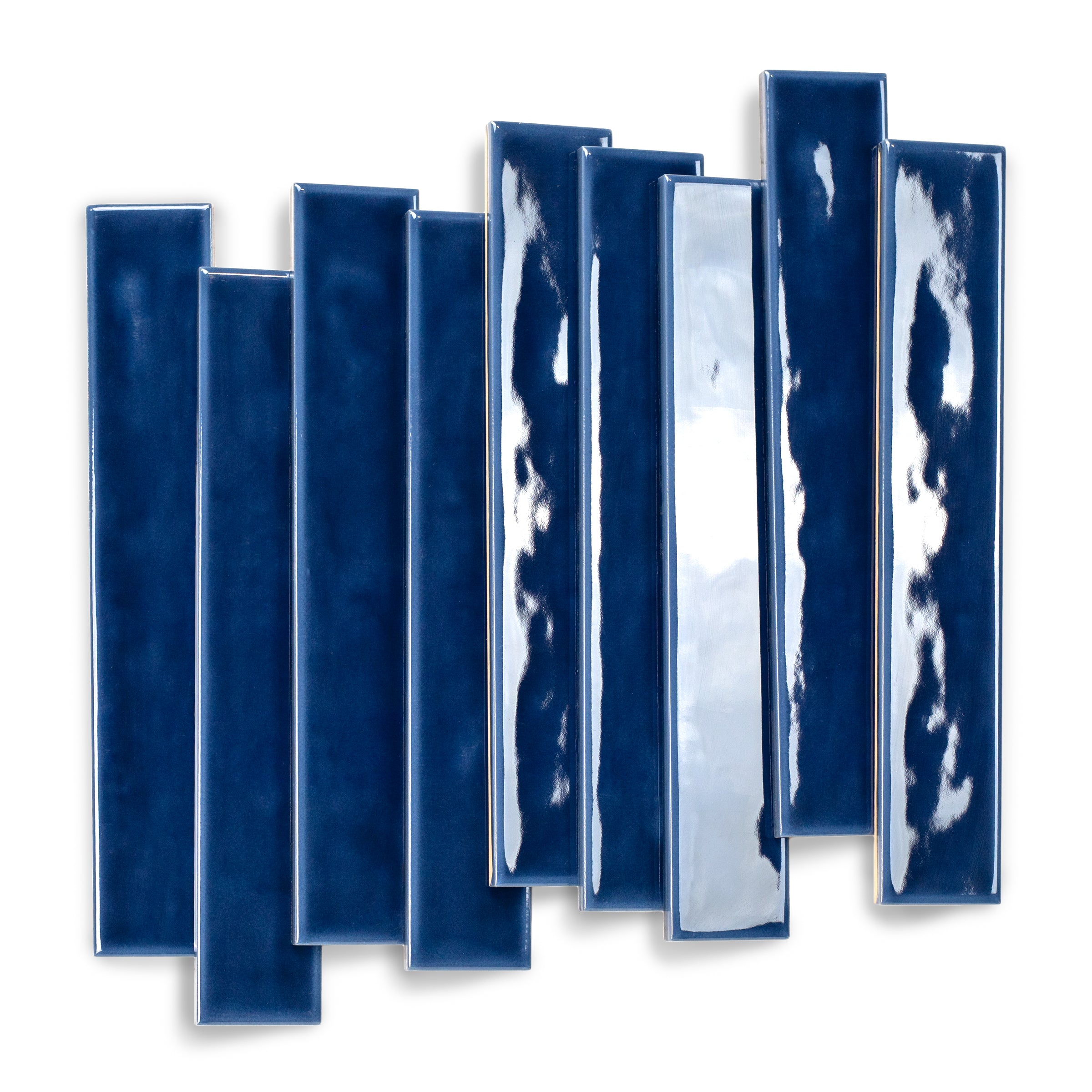 Glossy deep indigo ceramic tiles with slight waviness and reflective surfaces arranged in an overlapping pattern