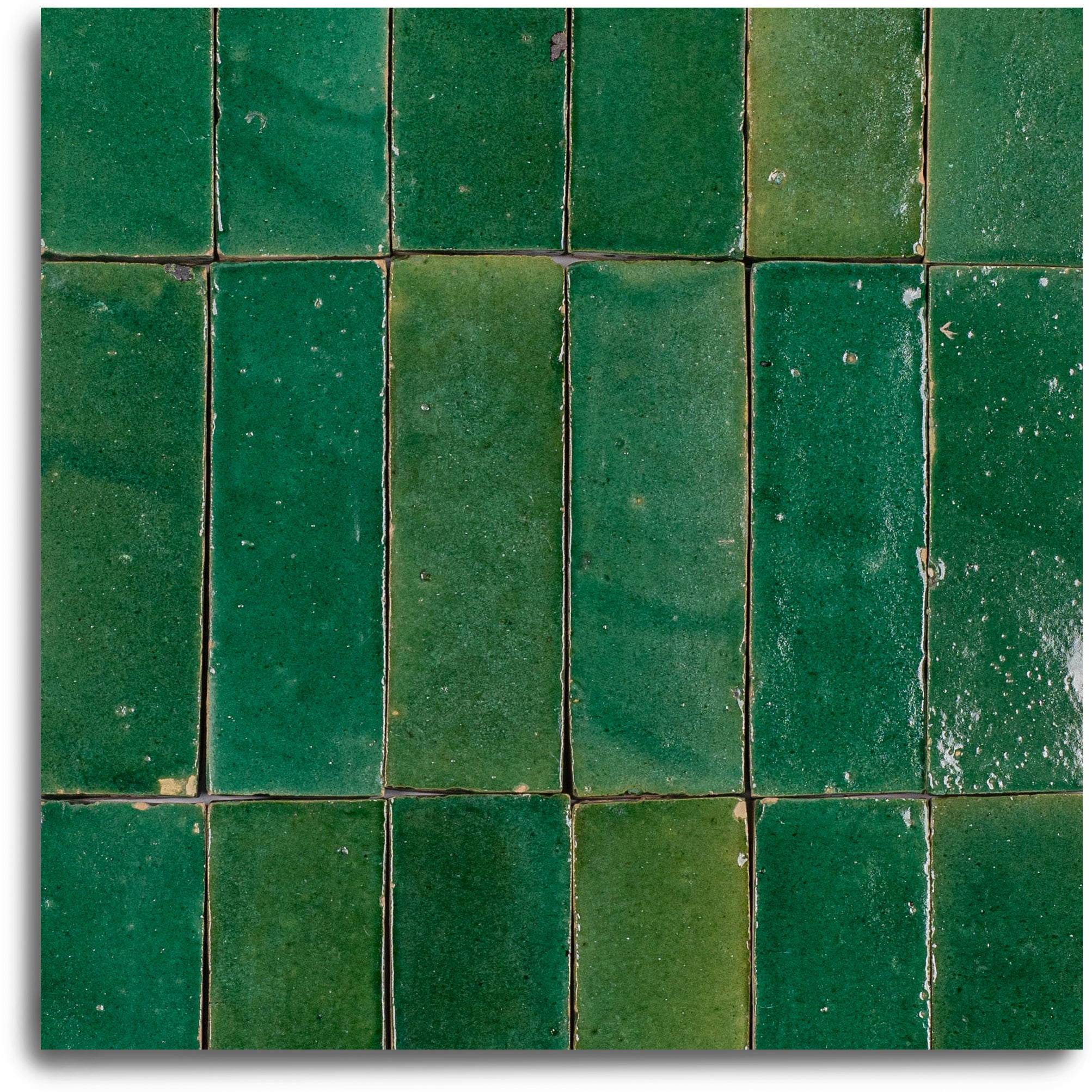 Jade Glazed Zellige Plinth in green terracotta with varied emerald to forest hues from Small Format Tiles and Handmade Moroccan Zellige Tiles
