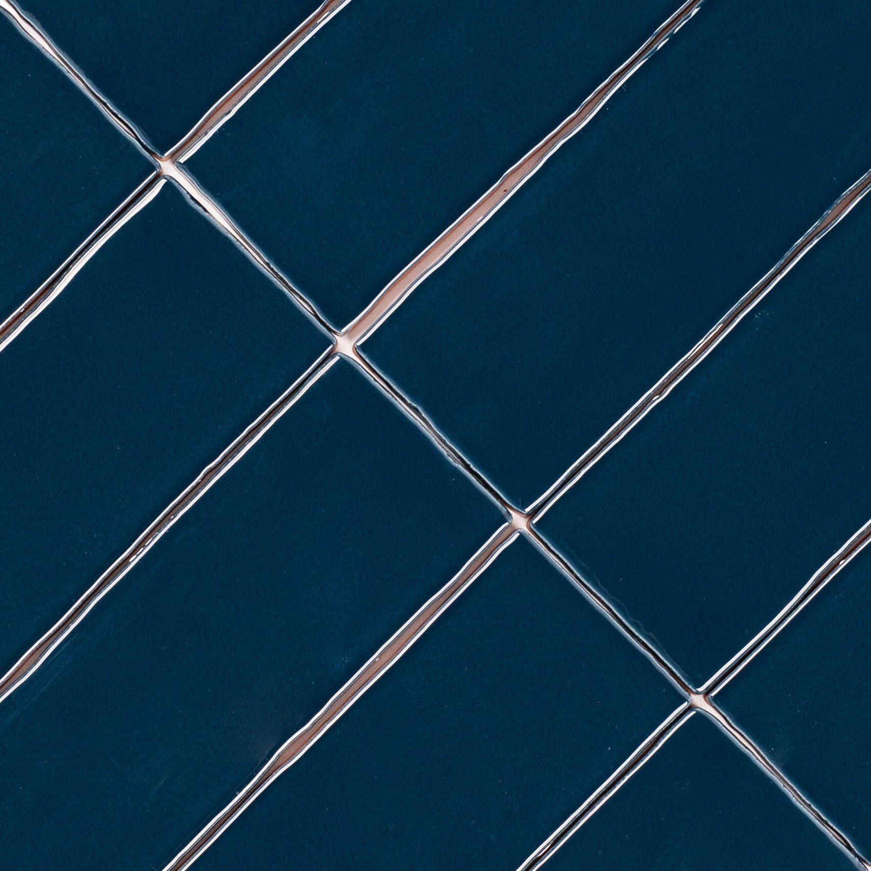 Marine 3x12 Glossy Ceramic Tile in deep teal with a rich gloss and slightly irregular edges from Seville Glossy Ceramic Tiles collection