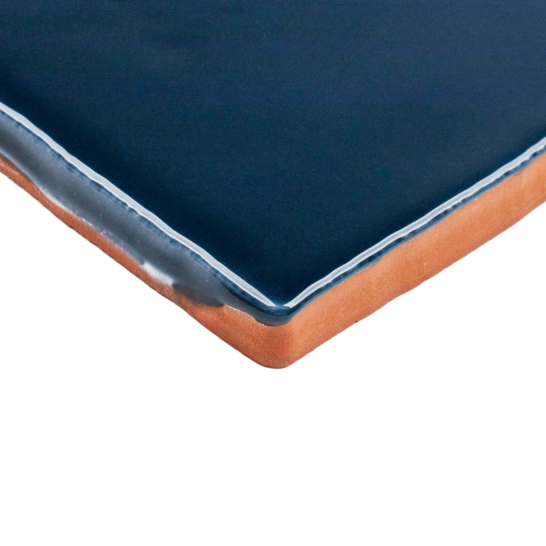 Marine 3x6 Glossy Ceramic Tile in deep teal-navy ceramic with rich gloss and slight handmade edge from Seville Glossy Ceramic Tiles collection