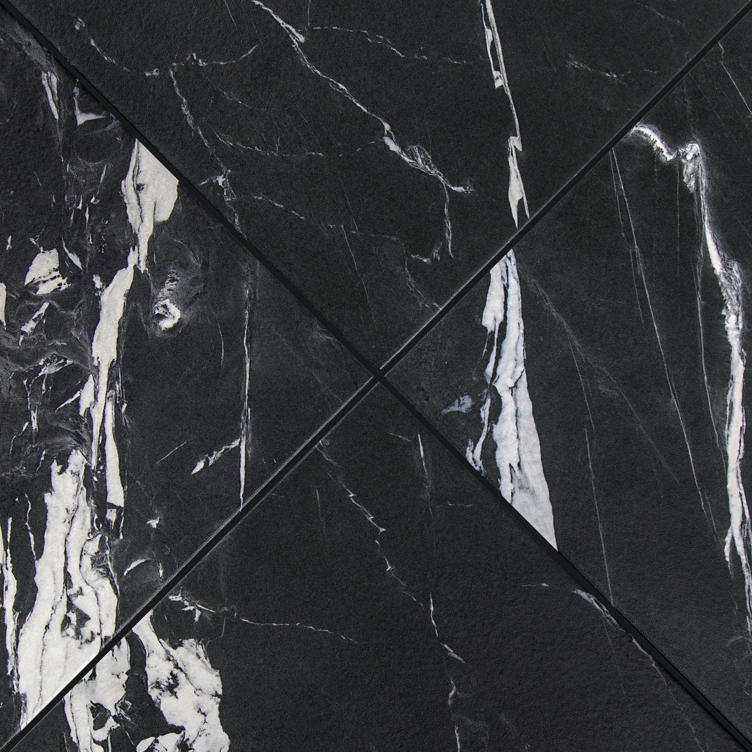 Montblack Matte Marble Look Porcelain Tile in black with bold white veining from Large Format Tiles at Reno Source