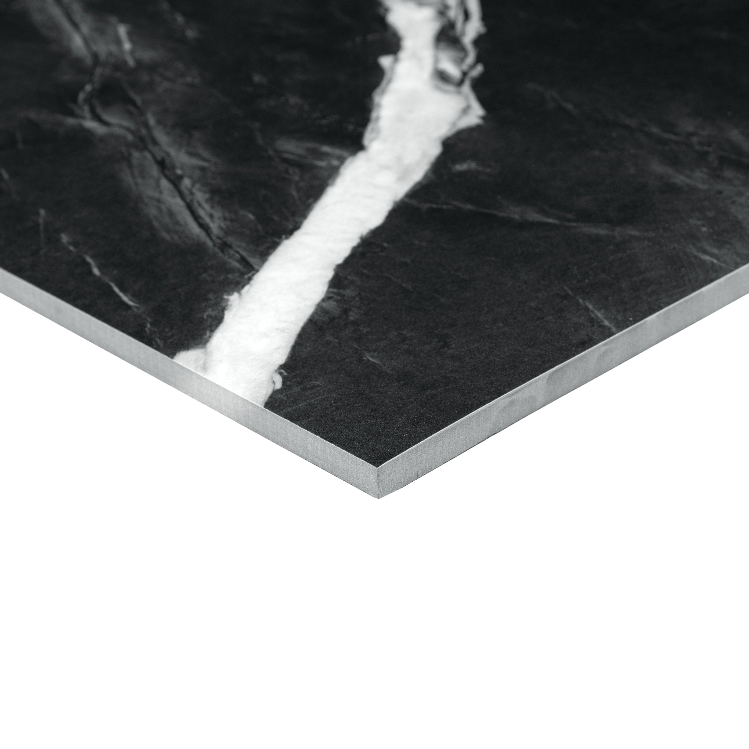 Montblack Matte Marble Look Porcelain Tile in black with bold white veining from Large Format Tiles at Reno Source