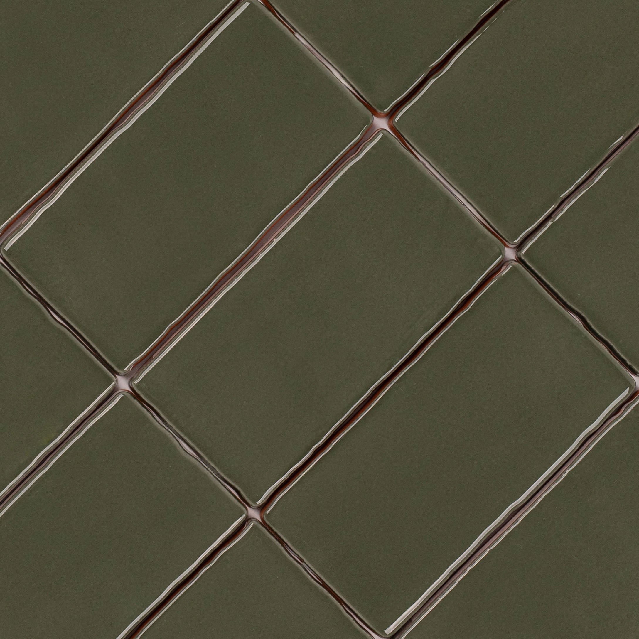 Olive 3x6 Glossy Ceramic Tile in deep muted green with glossy finish and slightly irregular edges from Seville Glossy Ceramic Tiles