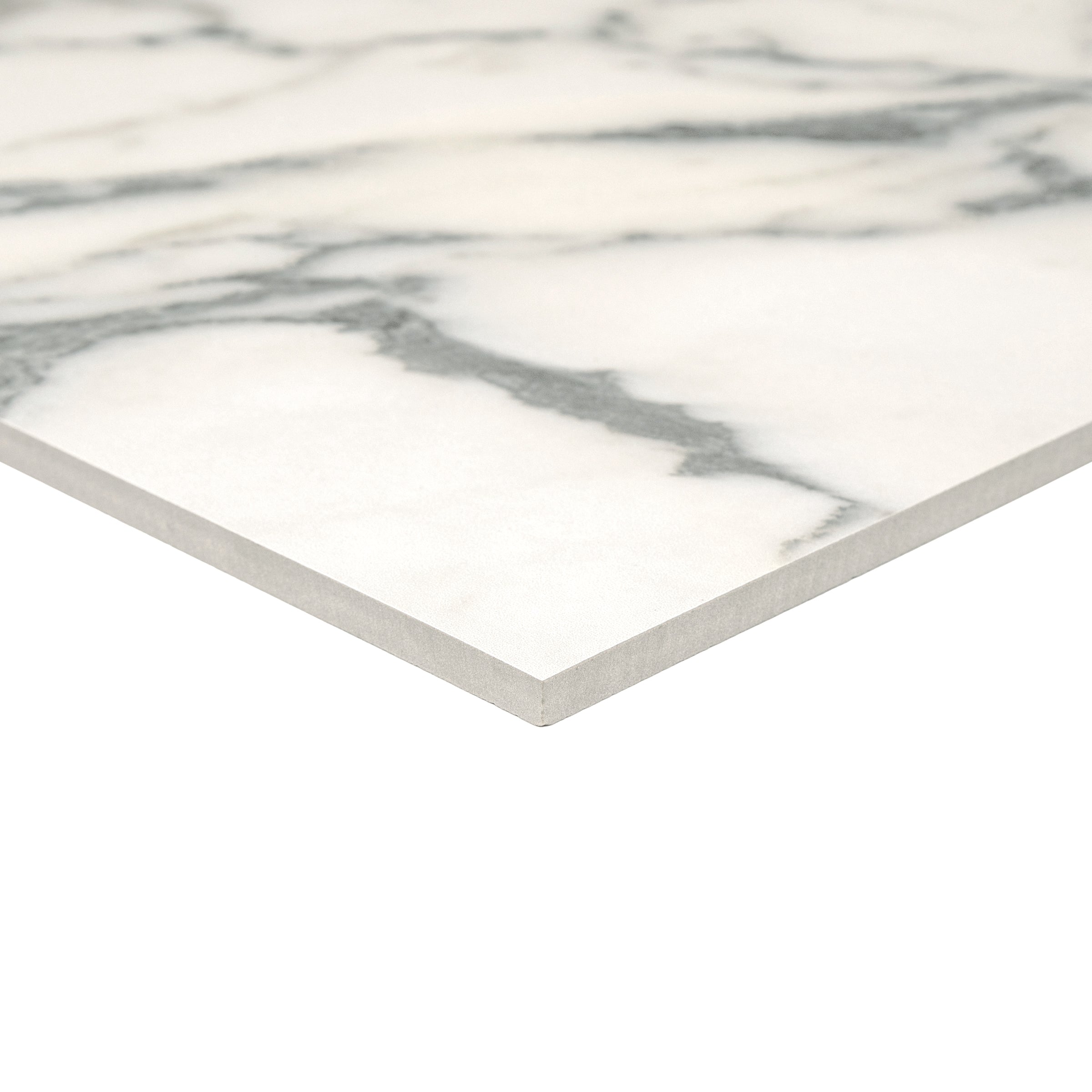 Close-up of a thin porcelain tile with white and light grey marble-inspired veining on a smooth surface