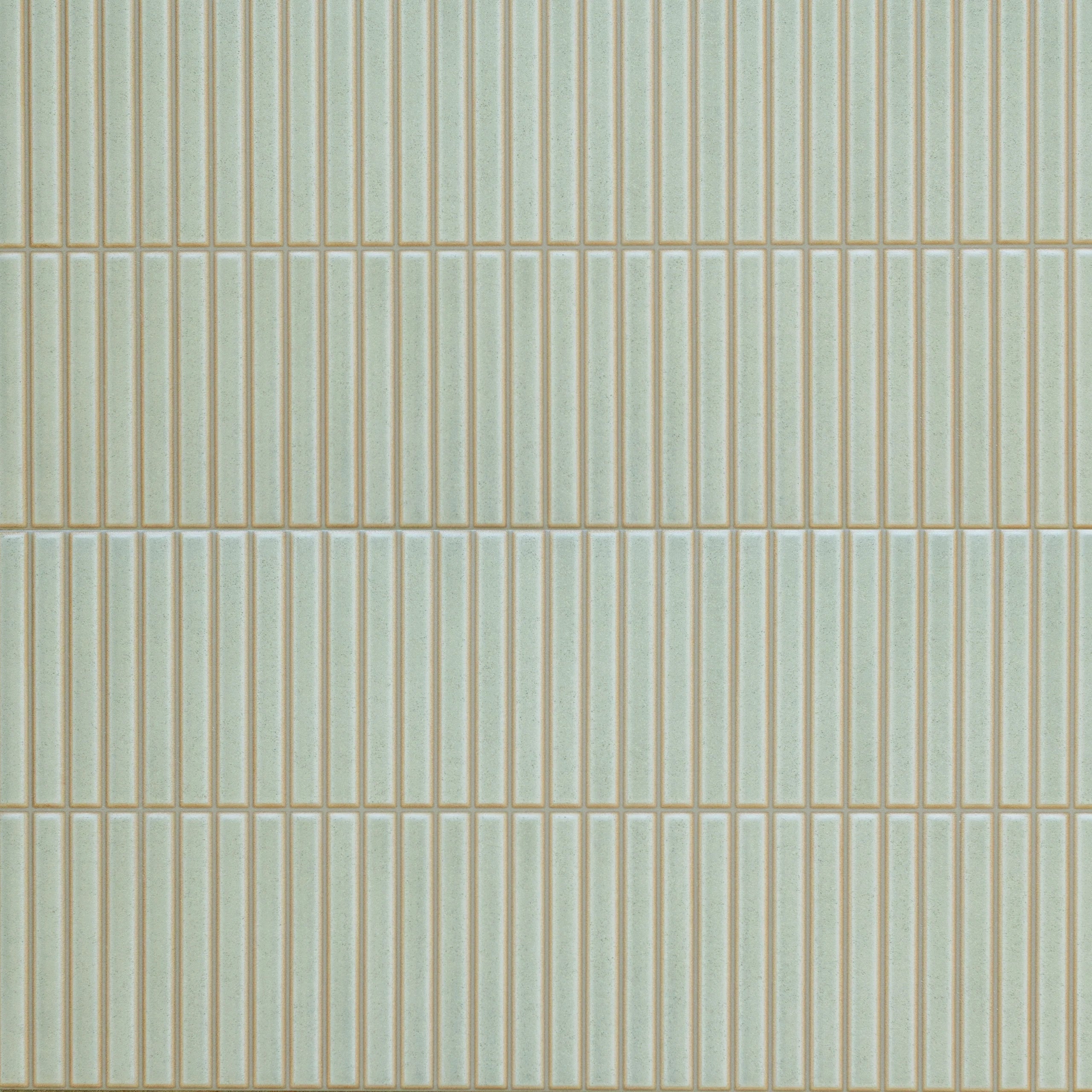 Rectangular green ceramic tiles with a vertical textured pattern and narrow beige grout lines for stylish wall design