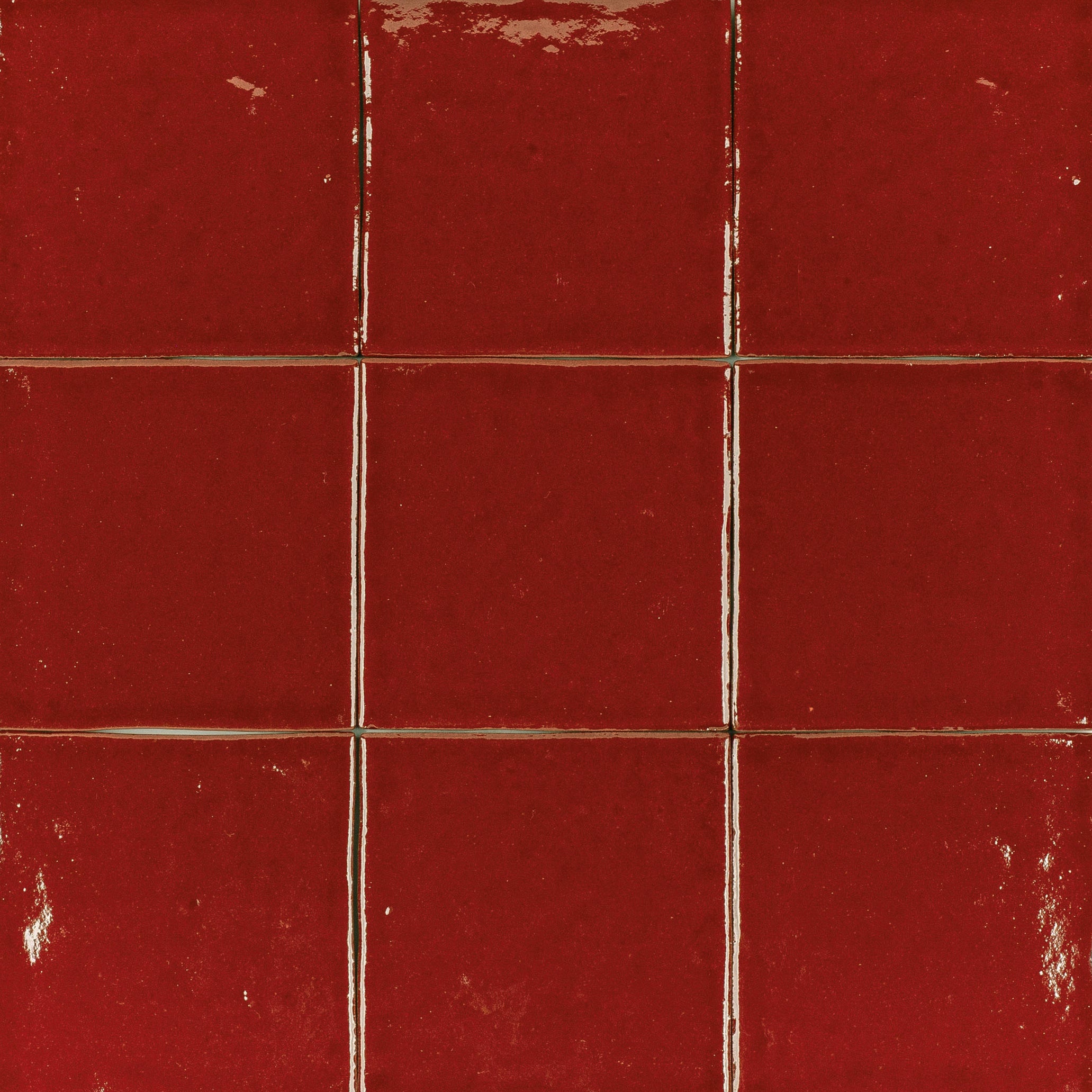 Ruby Glossy Ceramic Tile in rich red ceramic with handcrafted texture from Small Format Tiles and Zel Glazed Ceramic Tiles collections
