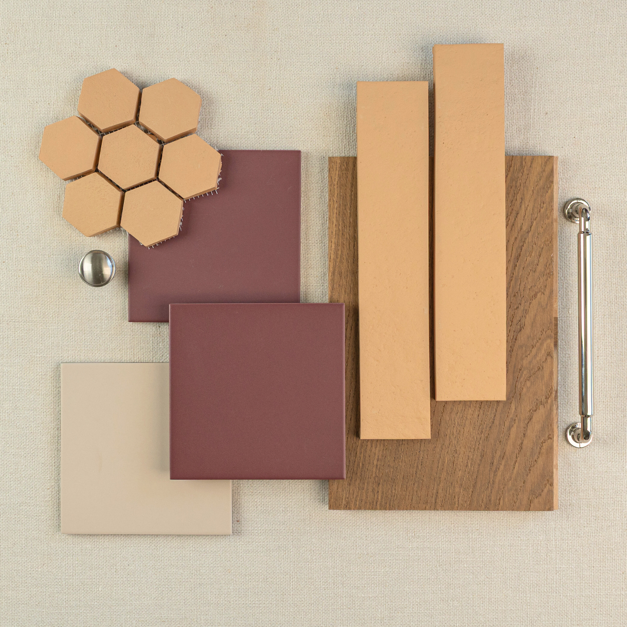 Assorted flat flooring and tile samples with hexagonal, square, and plank shapes in earthy beige and brown shades