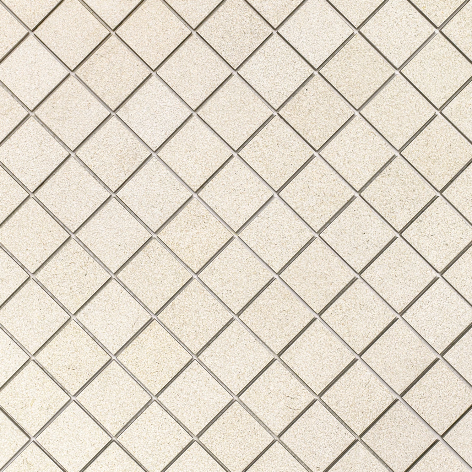 Almond Hammered Limestone Look Porcelain Mosaic in beige porcelain tiles from Stone Editions Porcelain Tile at Reno Source
