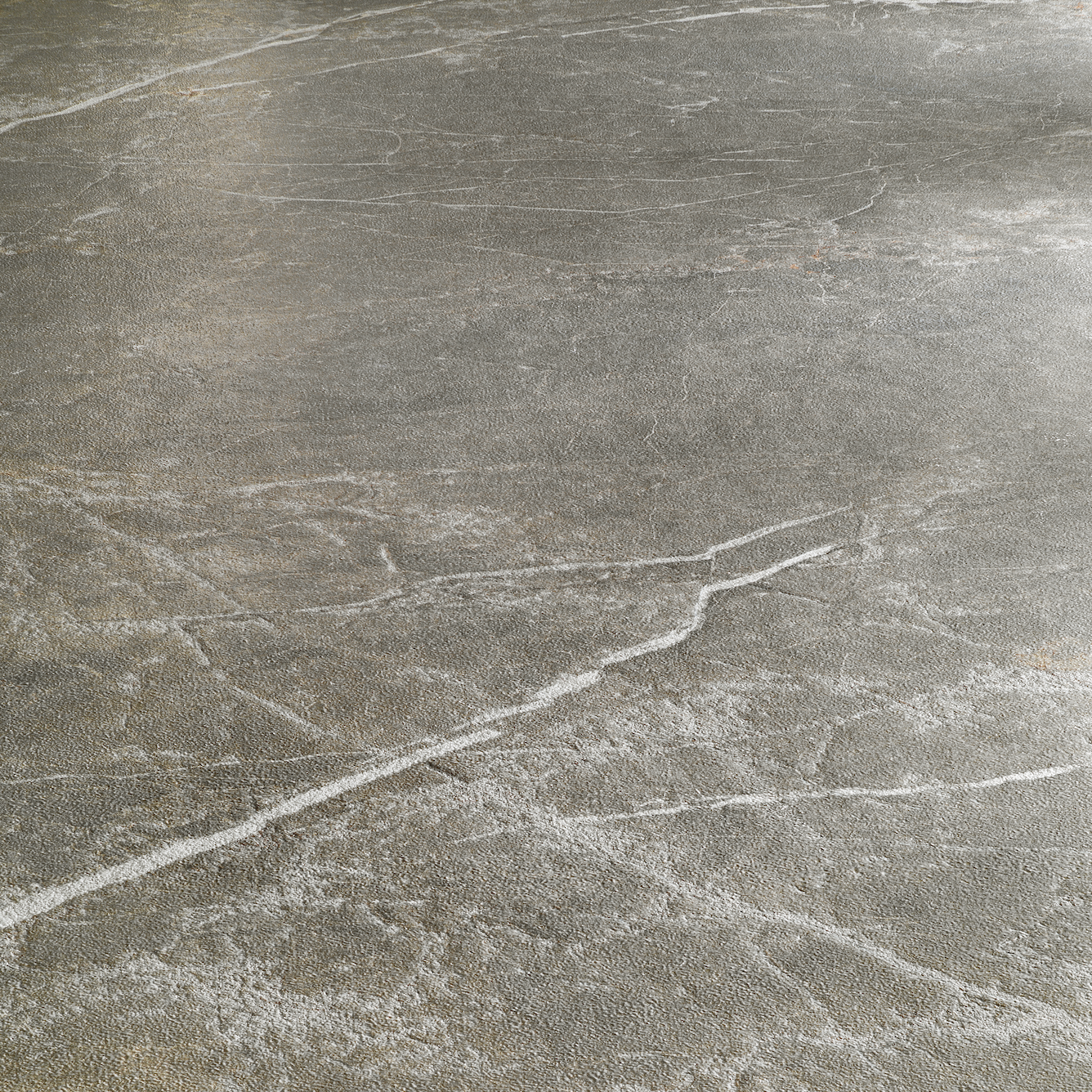 Textured gray porcelain tile surface with subtle natural veining and layered patterning in soft tones