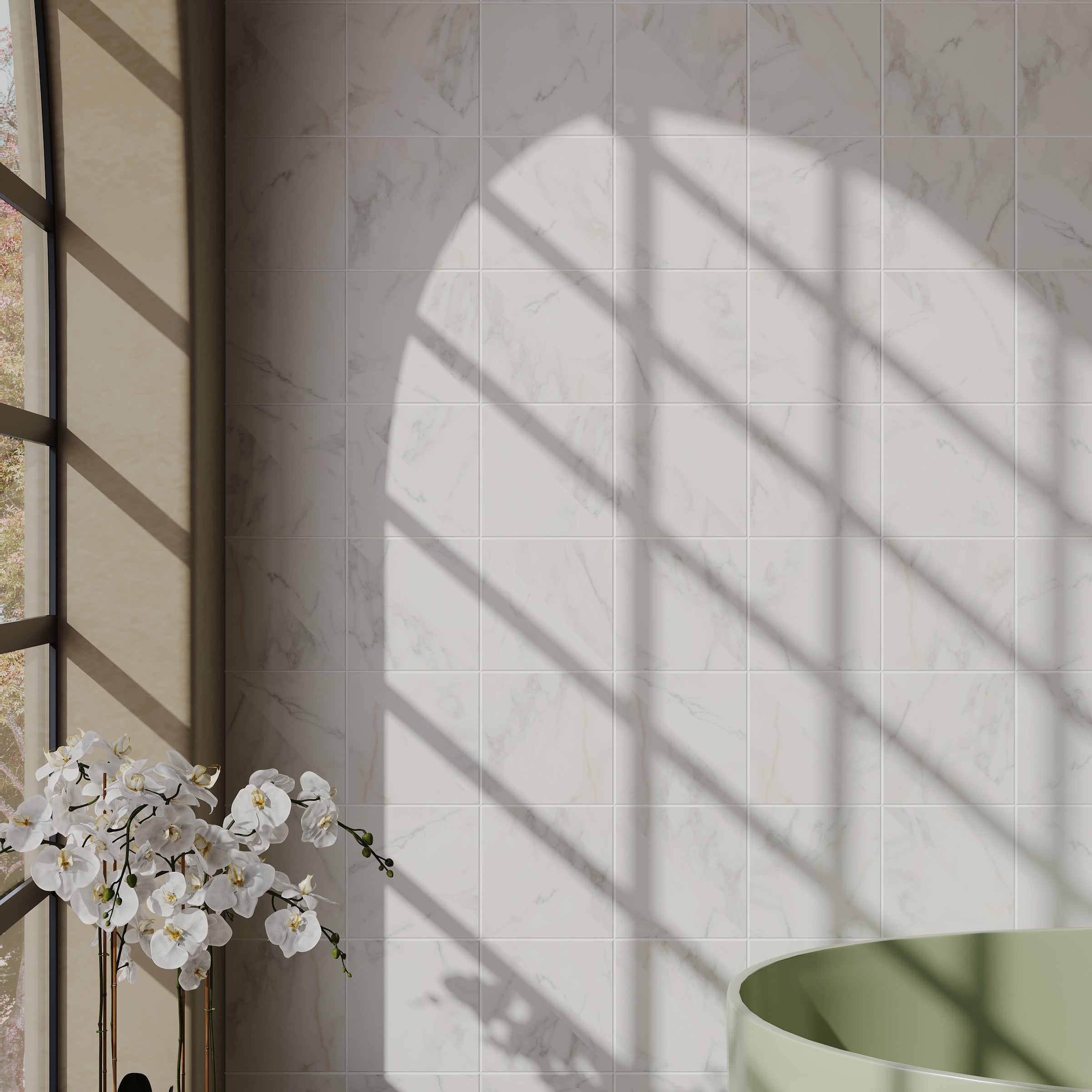 Sunlight casting grid shadows on smooth white marble-like porcelain tile wall beside white orchids and green tub