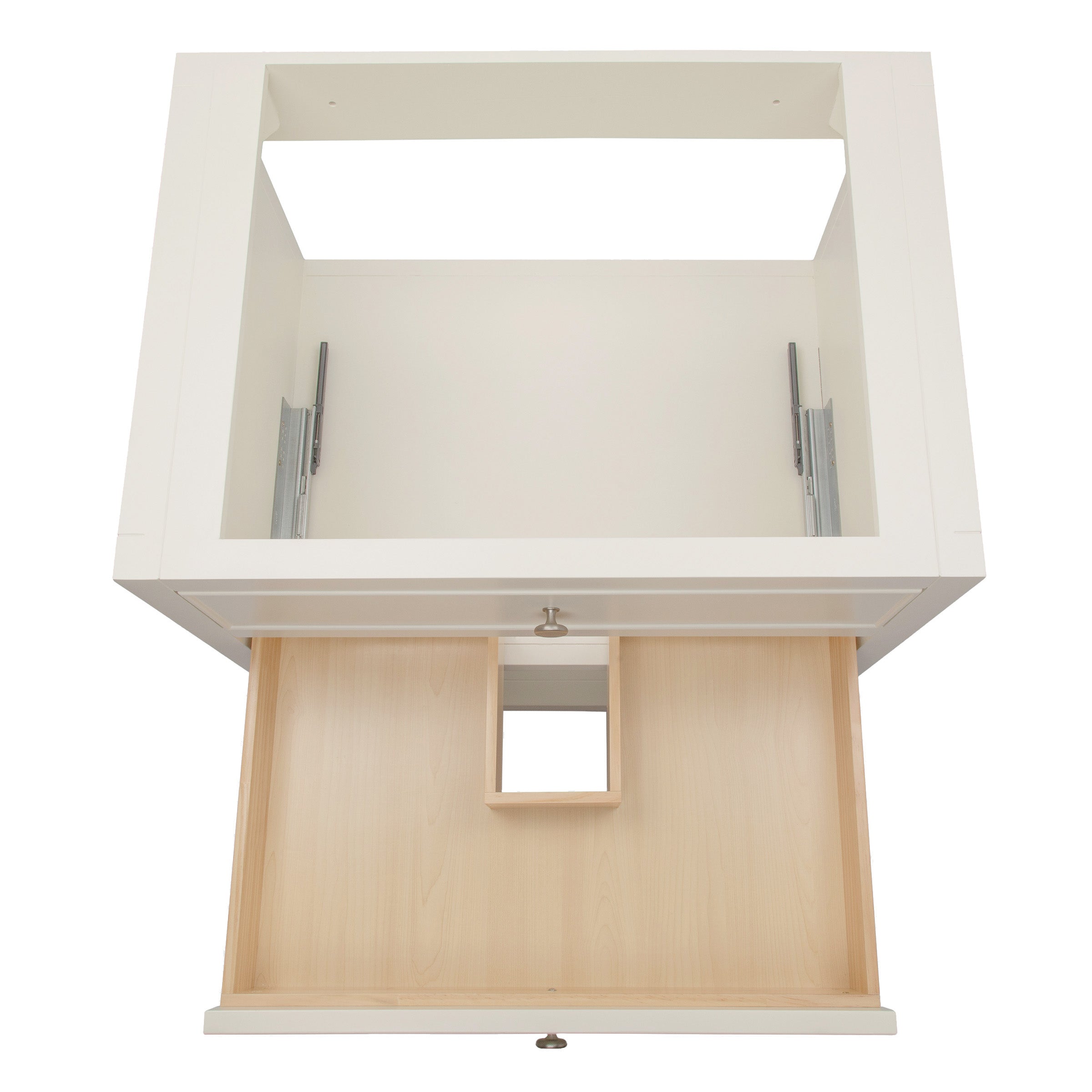 Top view of a white vanity frame with an open drawer featuring a central cutout and metal drawer slides visible inside.