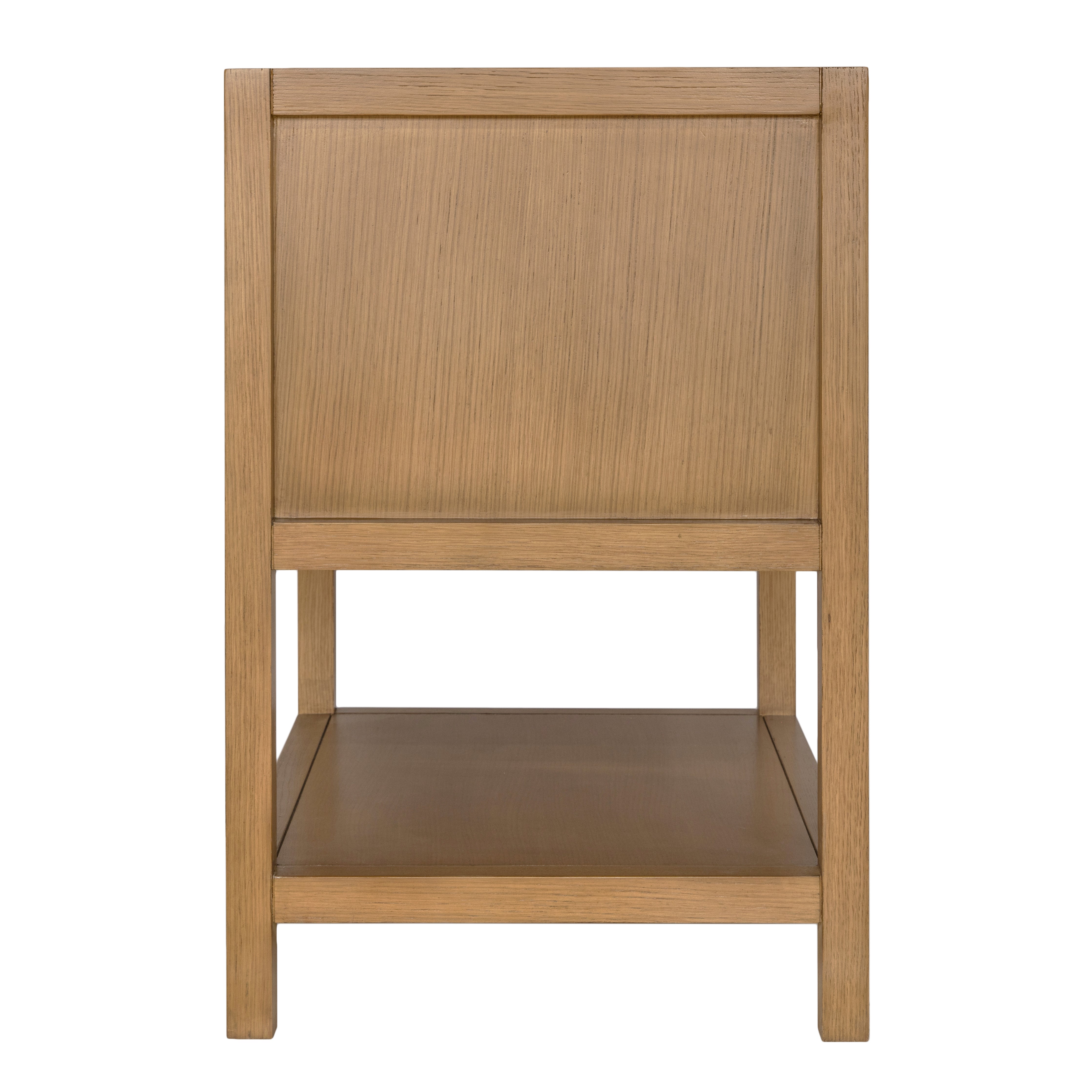 Side view of a wooden furniture piece with a panel design and a lower open shelf against a white background