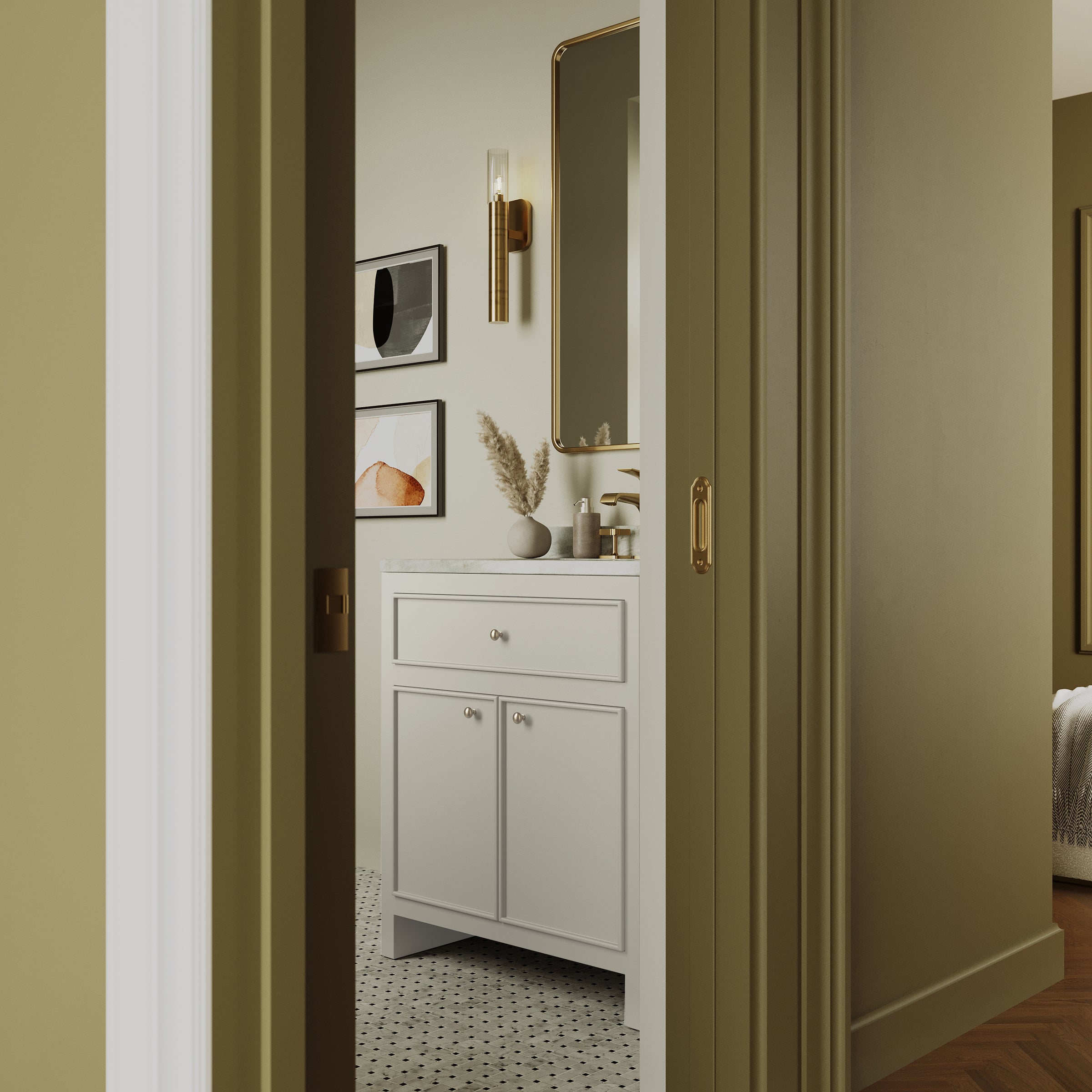 View through partially open door of elegant bathroom with white vanity, mirror, framed art, and patterned tile floor
