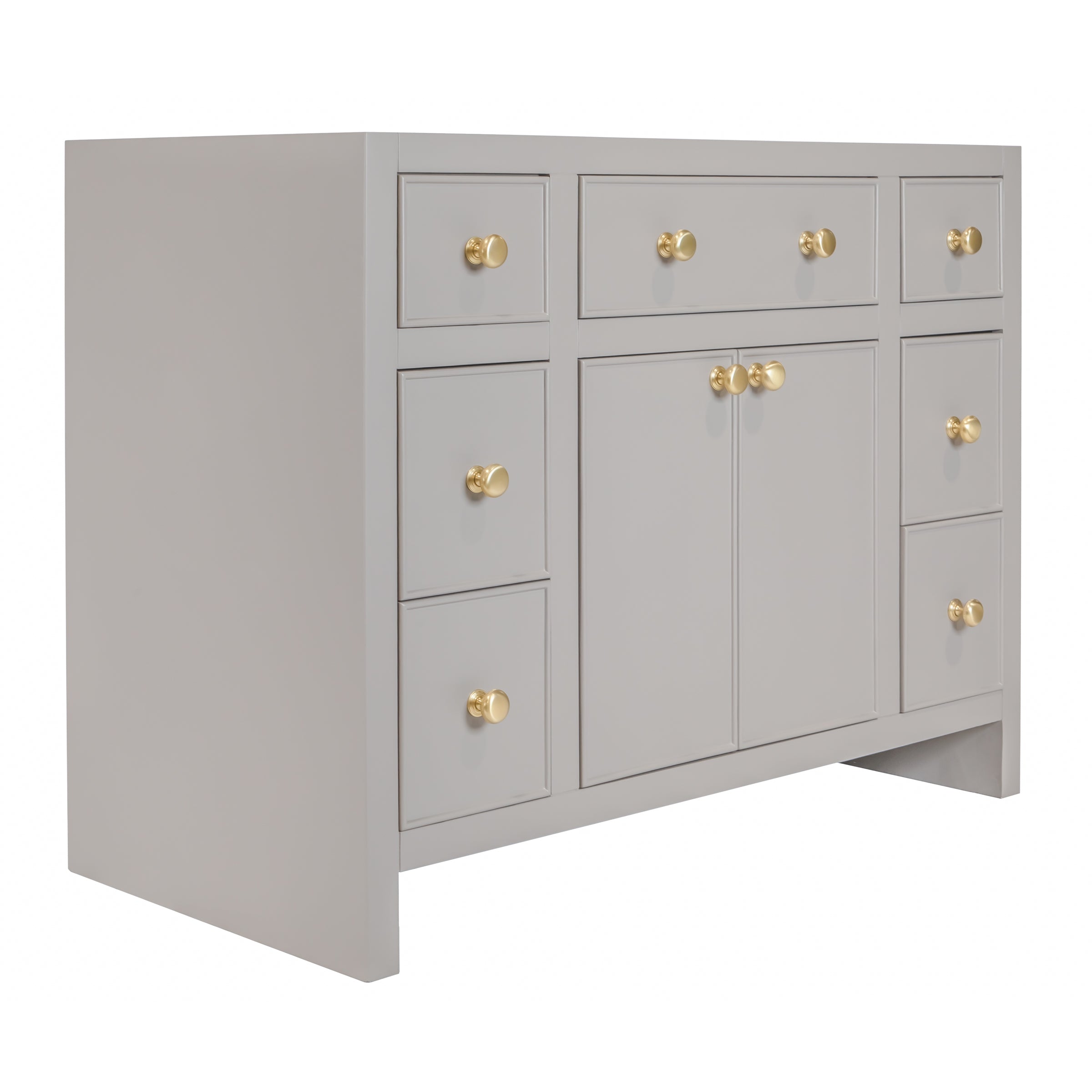 Light gray vanity with multiple drawers and gold-colored round knobs in a modern design style