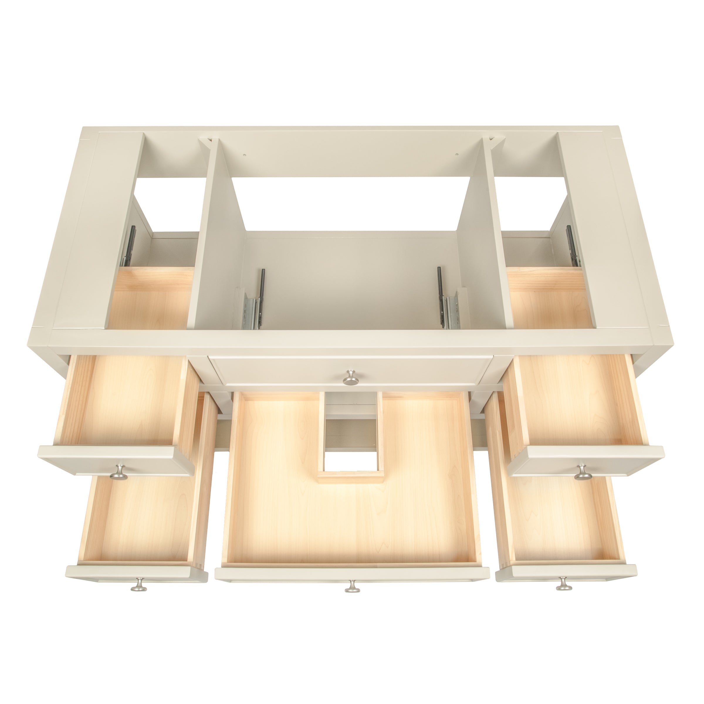 Top view of a cream-colored vanity with multiple open drawers and central cutout for plumbing access in clean design