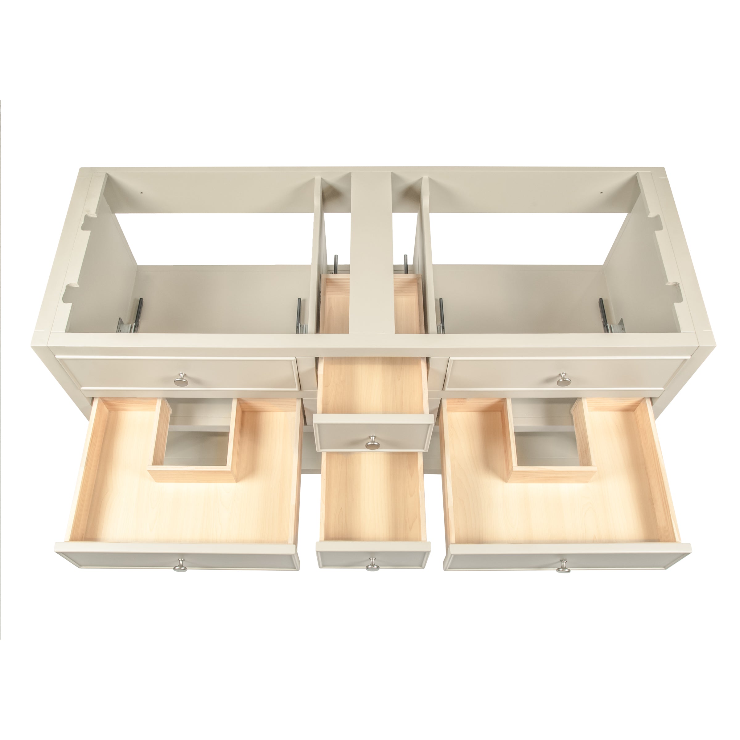 Overhead view of a cream-colored wooden vanity with open drawers showing light natural wood interiors and metal knobs