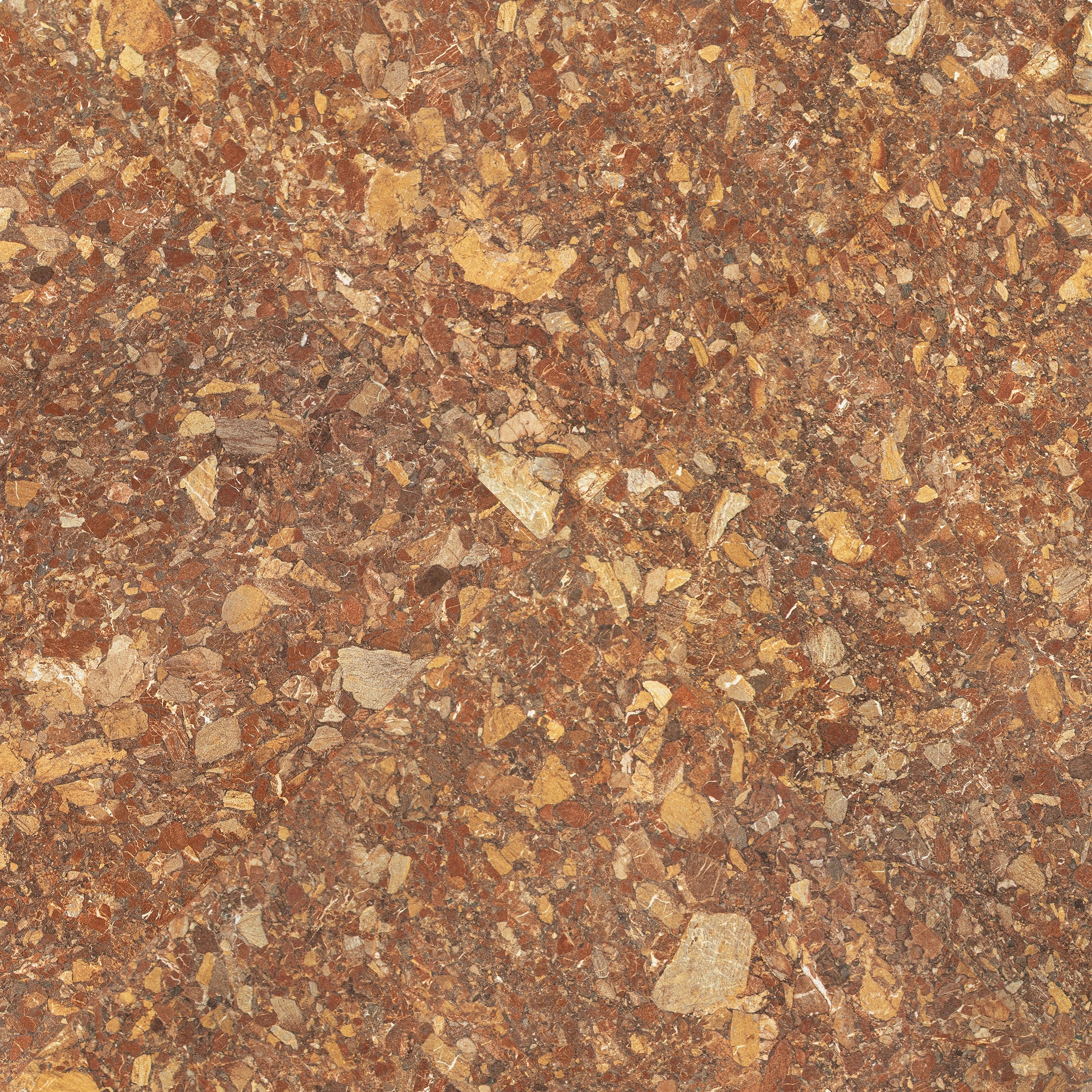 Close-up of polished tile surface with warm terracotta and ochre fragments in a dense natural stone pattern