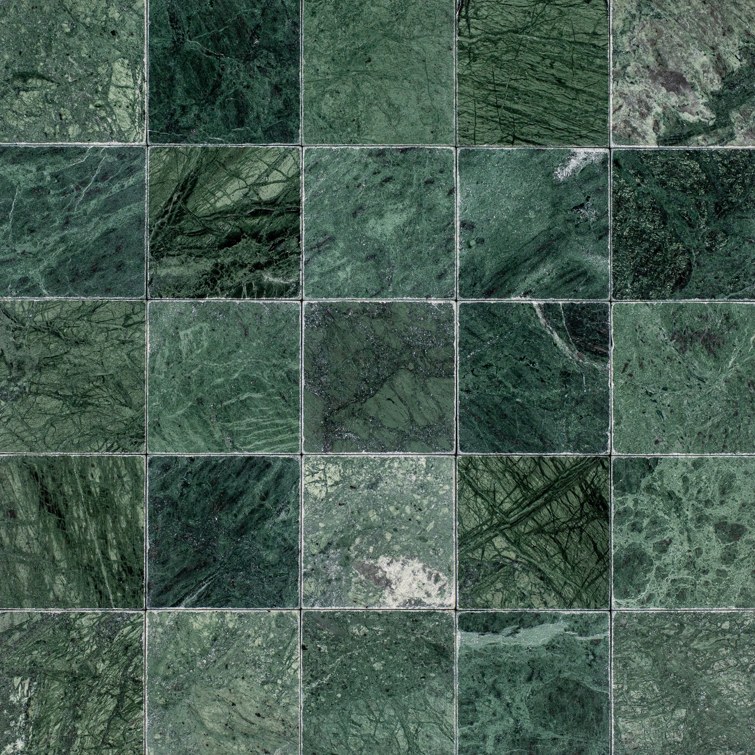 Verde Guatemala 4x4 Tumbled Marble Tile in deep green with bold white veining from Tumbled Natural Stone Tiles collection