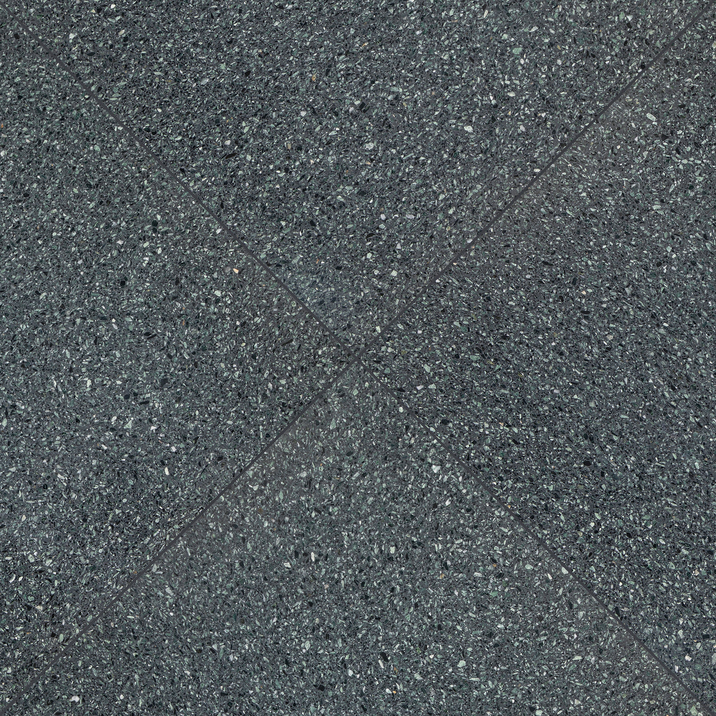 Close-up of dark grey large format tile with subtle texture and fine grain pattern visible on surface