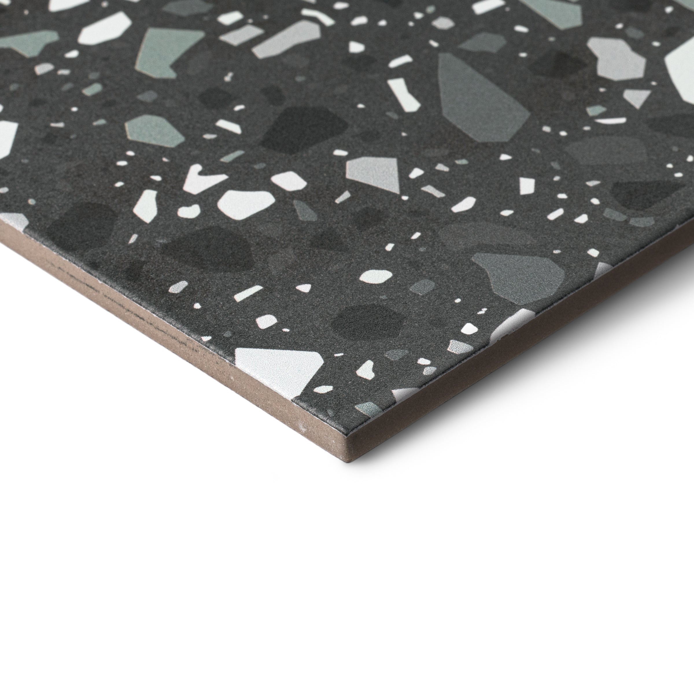 Close-up of Black 2 Confetti Porcelain Tile from the Porcelain collection with scattered light and dark speckles design.
