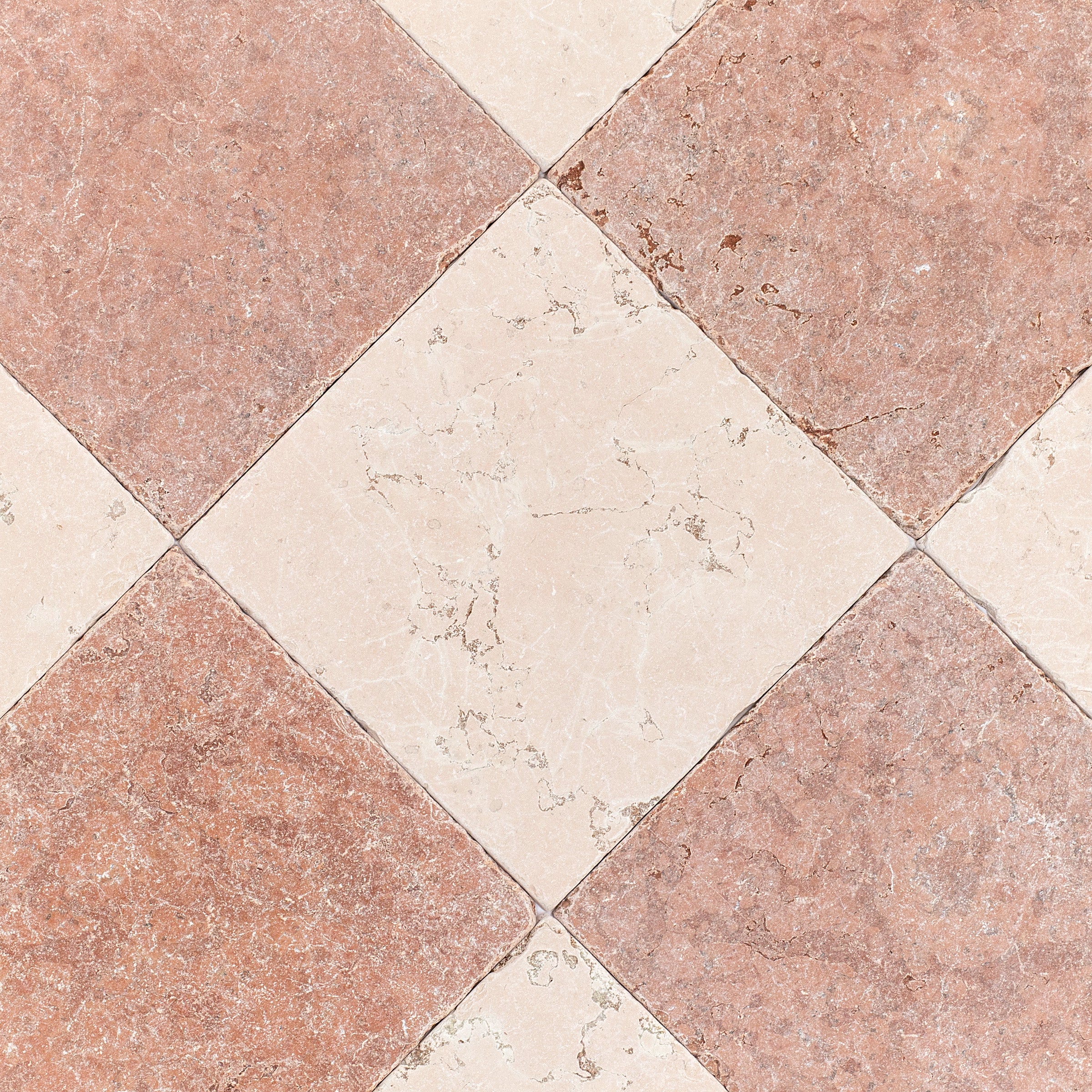 Diamond-patterned ceramic tile floor with earthy terracotta and cream marble textures in a classic layout