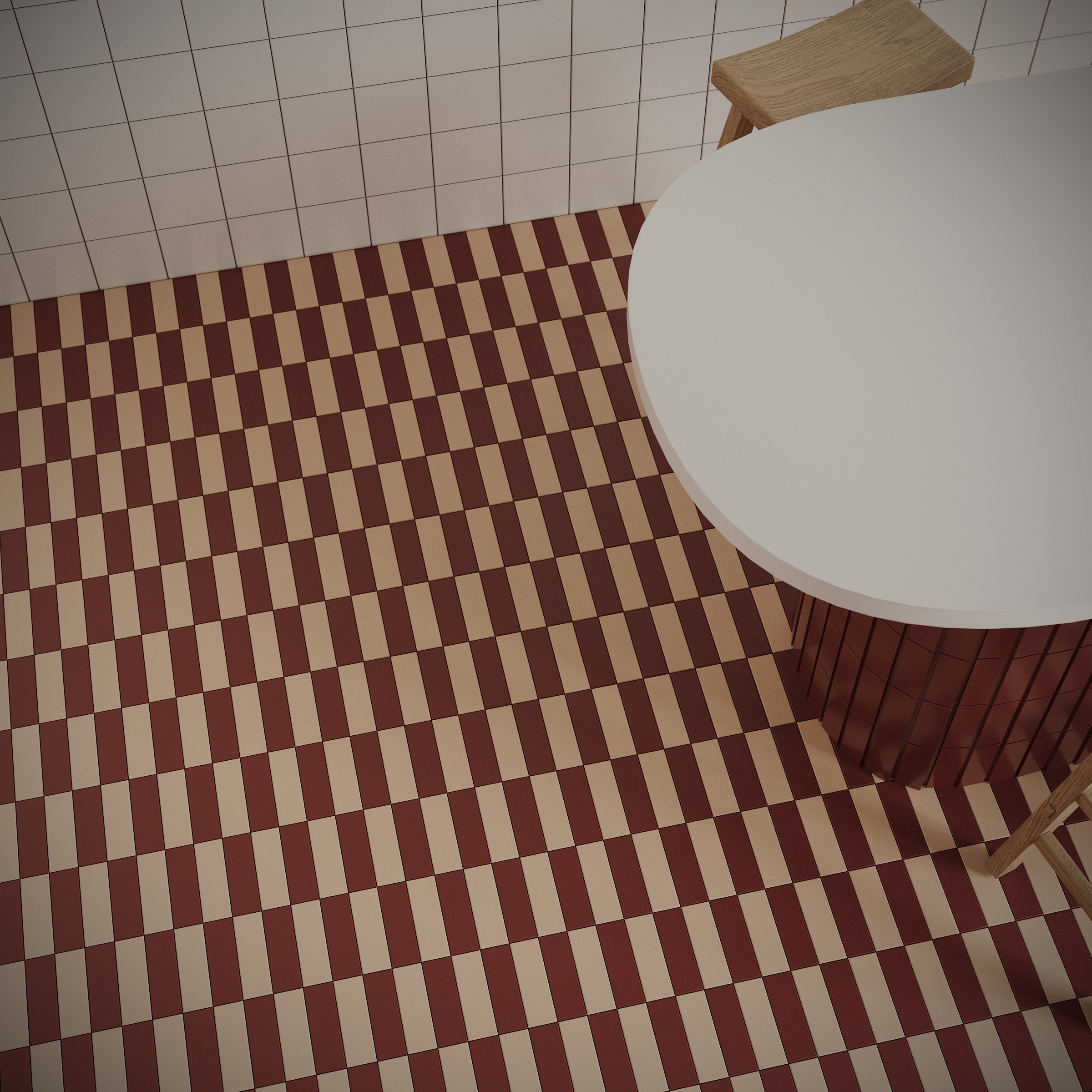 Checkerboard patterned ceramic tile floor in warm brown and beige with round white table and wooden chairs nearby