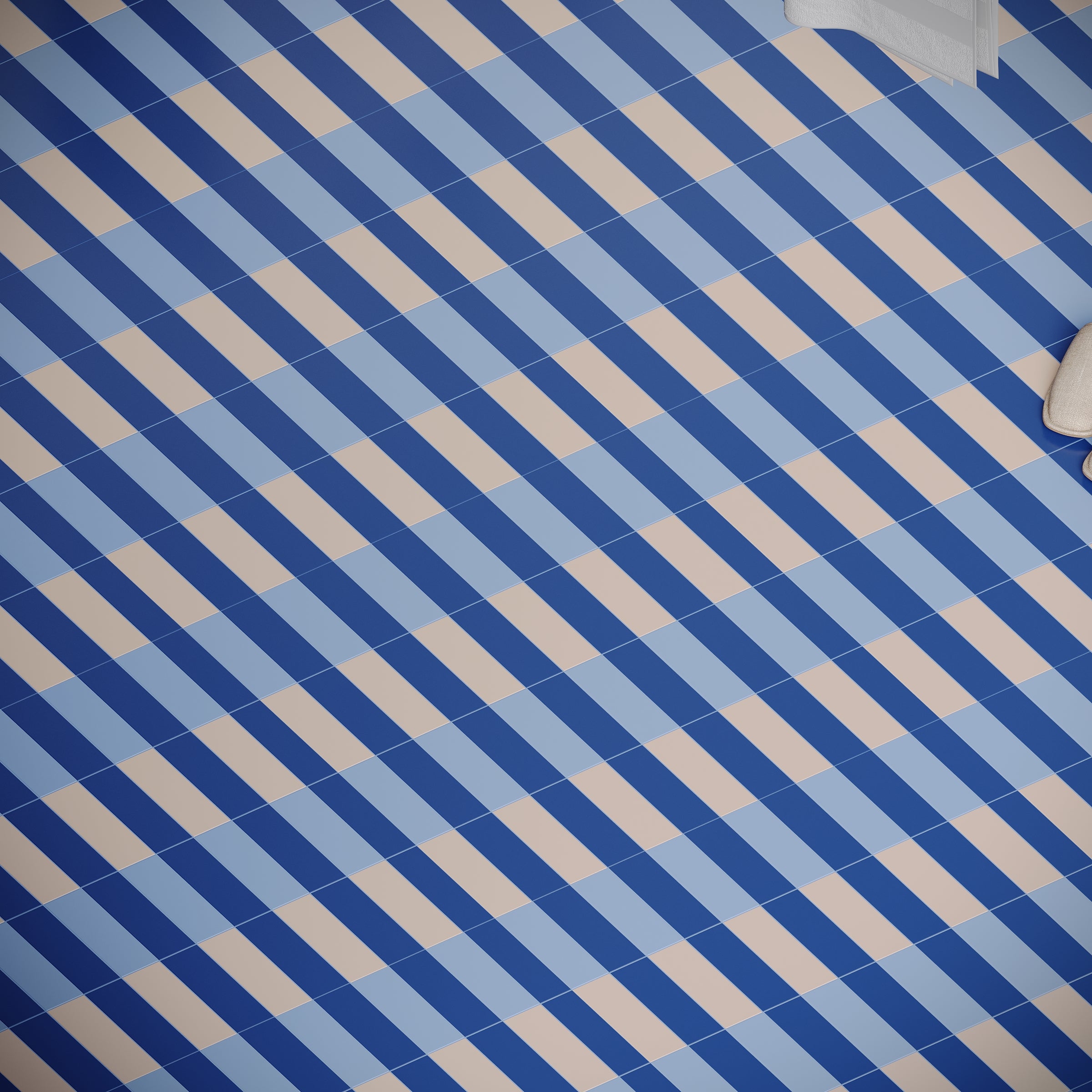 Diagonal striped floor tiles in varying shades of blue creating a geometric pattern with soft beige accents