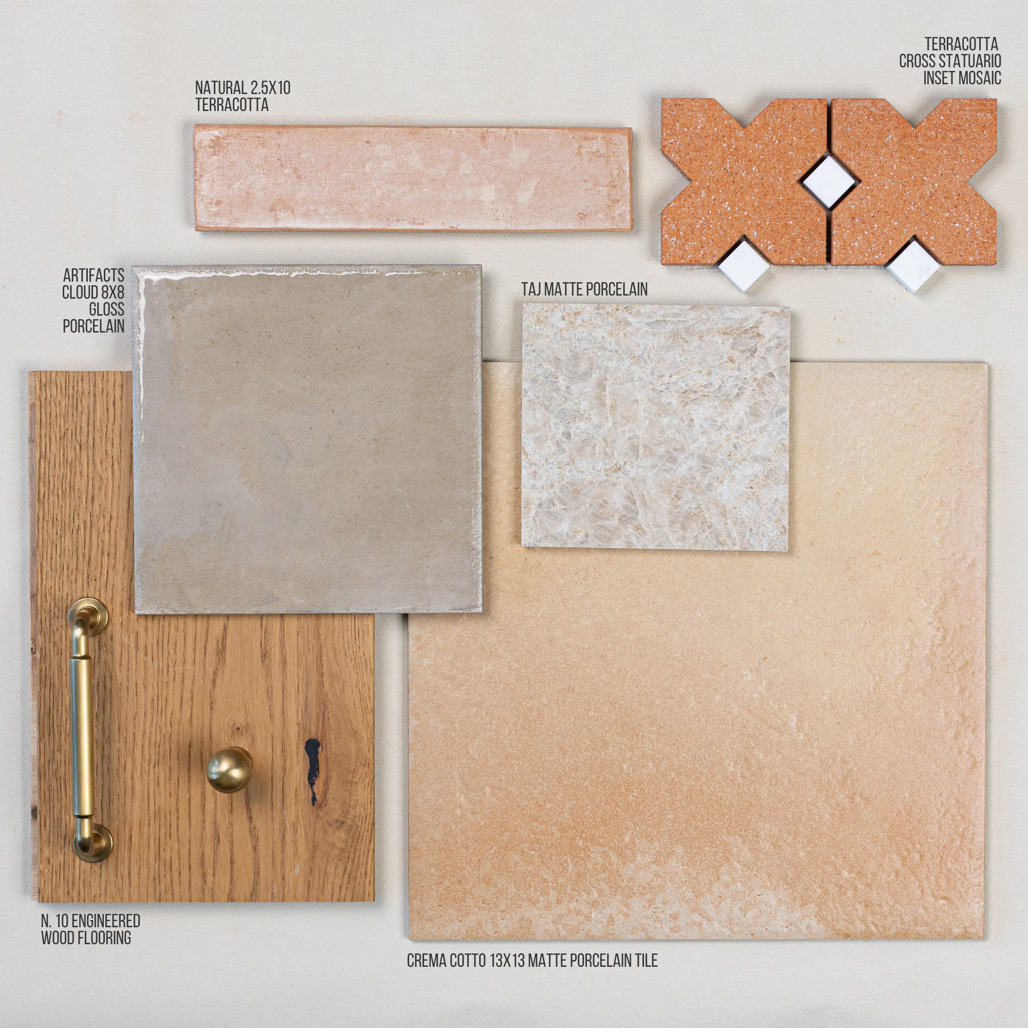 Selection of terracotta, porcelain, and engineered wood tile samples with brass hardware on pale neutral background