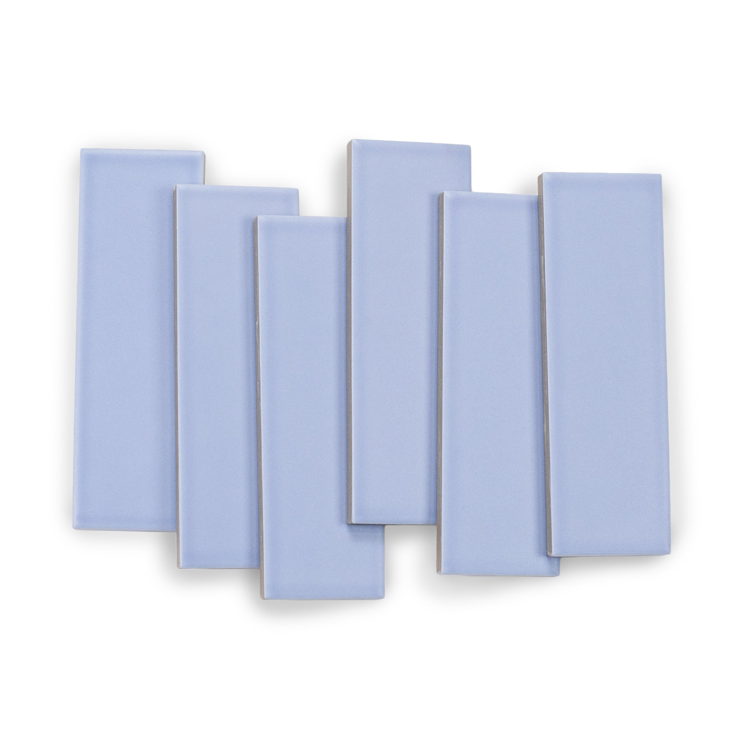Matte rectangular porcelain tiles in a soft lavender shade with smooth surfaces arranged in an overlapping pattern